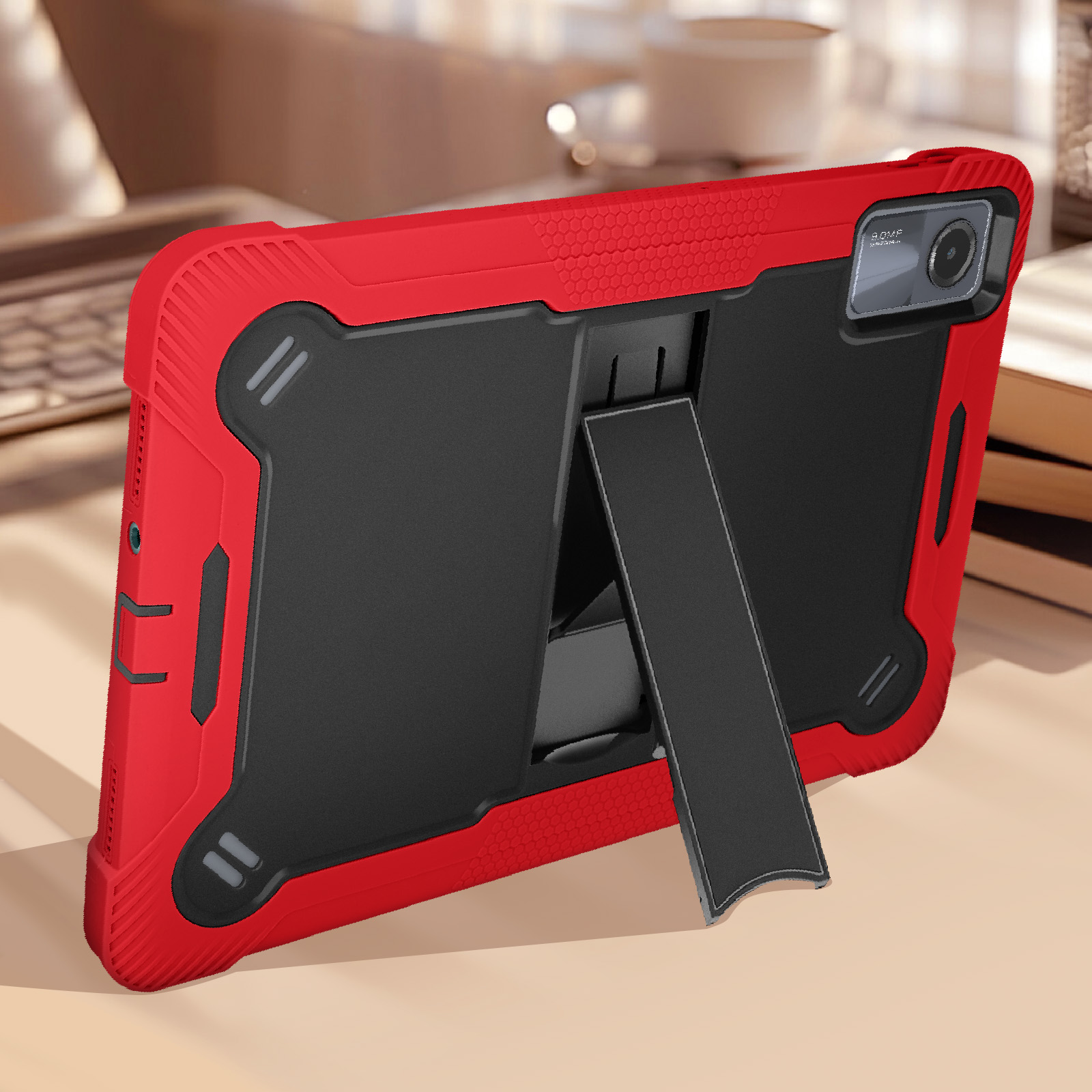 Custodia per tablet rossa e nera, con tablet e supporto.