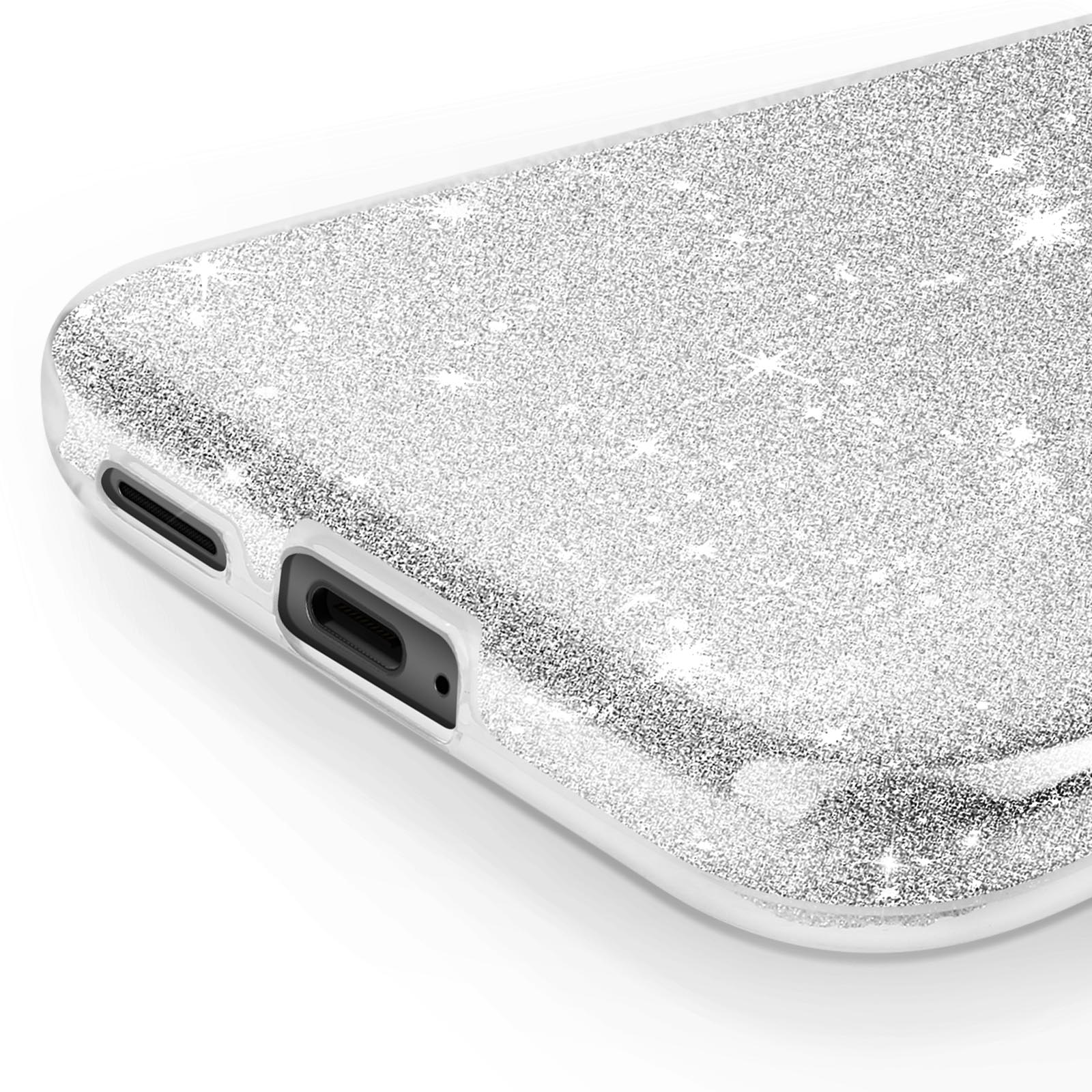 Primo piano di una cover per telefono con una superficie argentata glitterata. Mostra la porta di ricarica e gli altoparlanti.