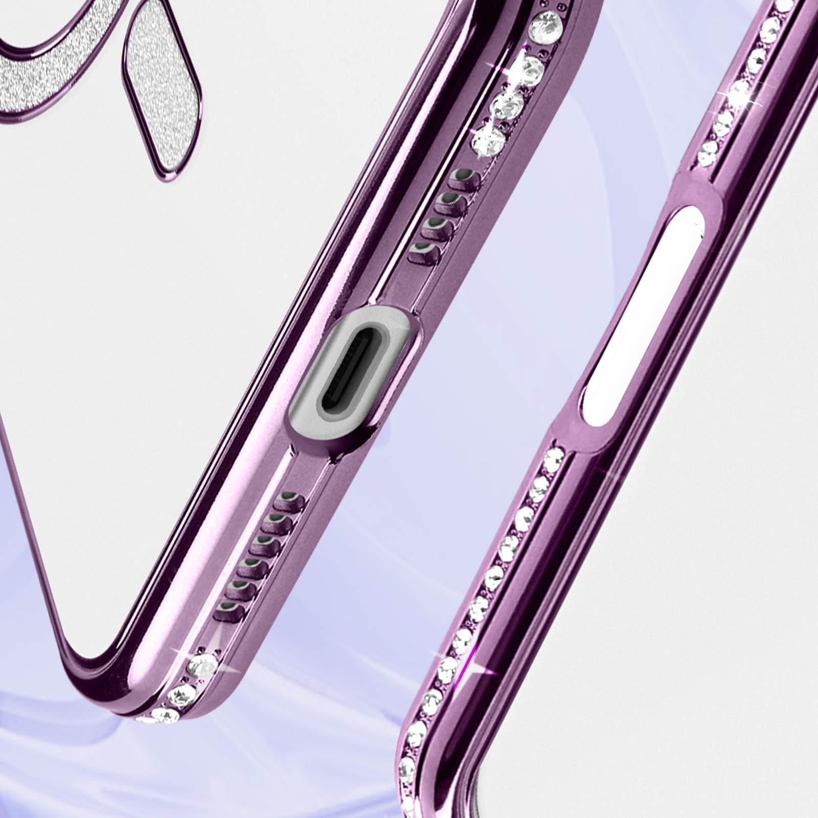 Custodia viola con strass. Il telefono è in primo piano.