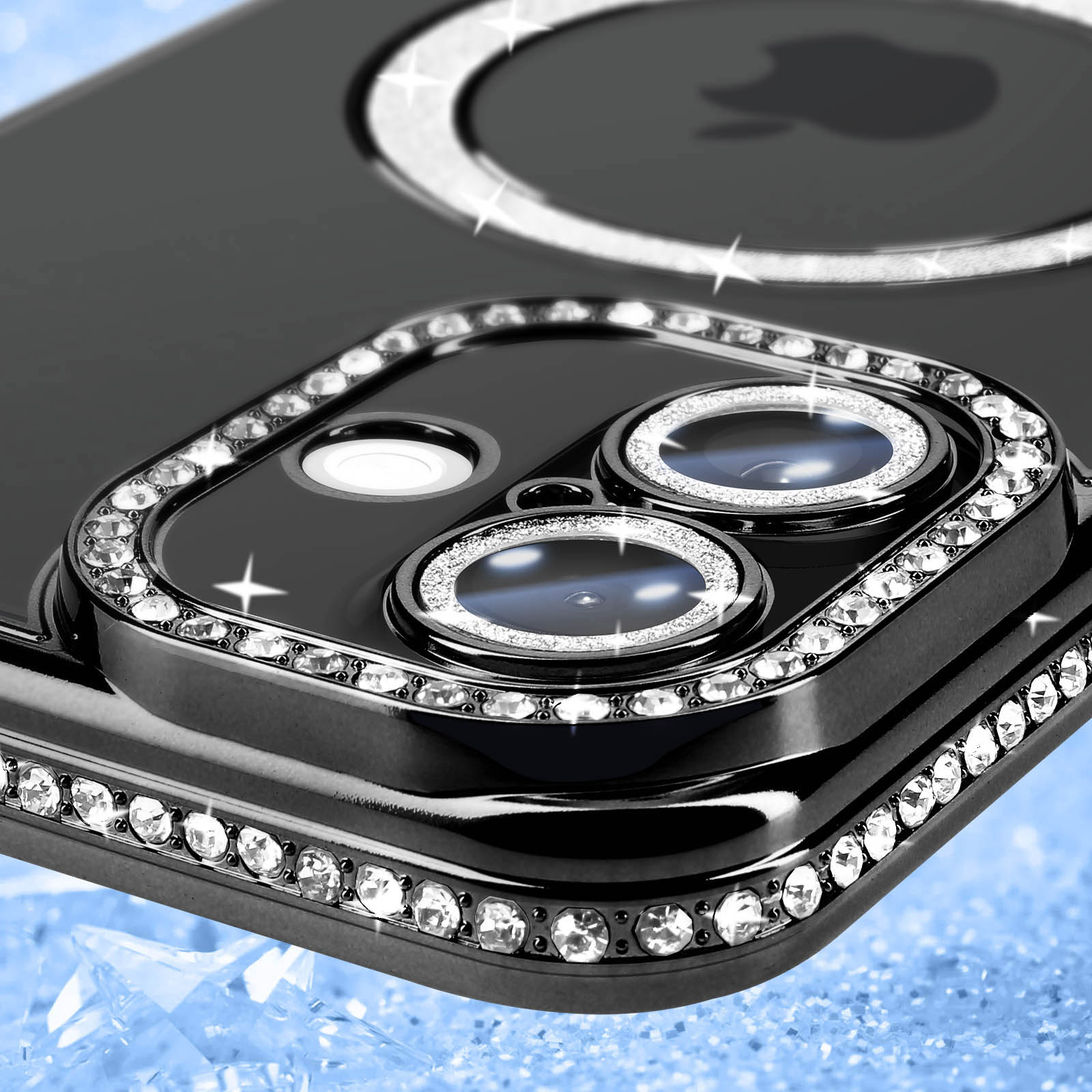 Primo piano di una fotocamera di un telefono nero con un anello di strass attorno alle lenti.