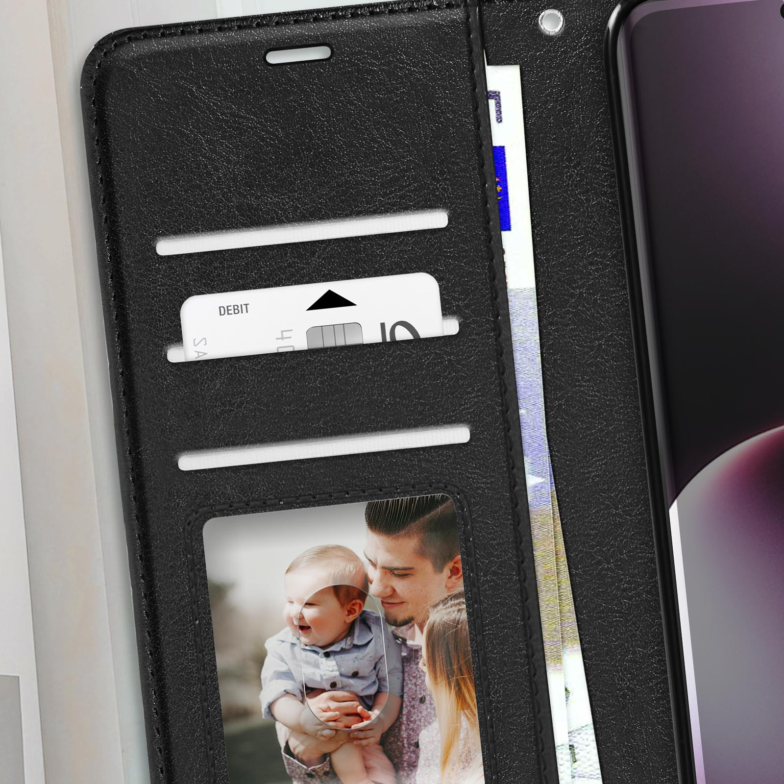Custodia per telefono nera con slot per carte, una foto e un telefono. La custodia è aperta, mostrando il contenuto.