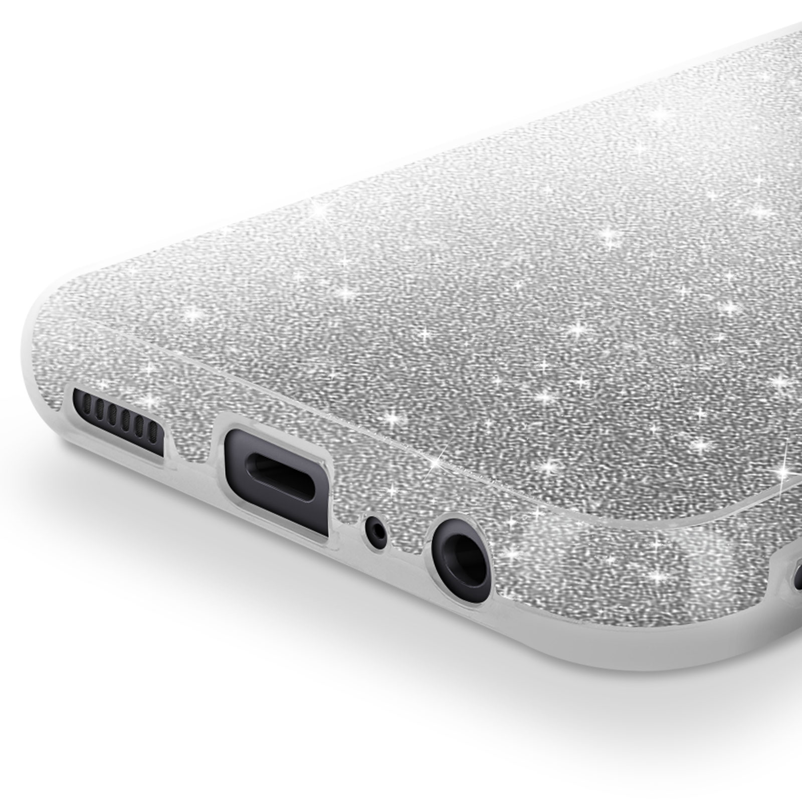 Primo piano della parte inferiore di un telefono. Il telefono ha una finitura argentata e glitterata e ritagli per le porte.