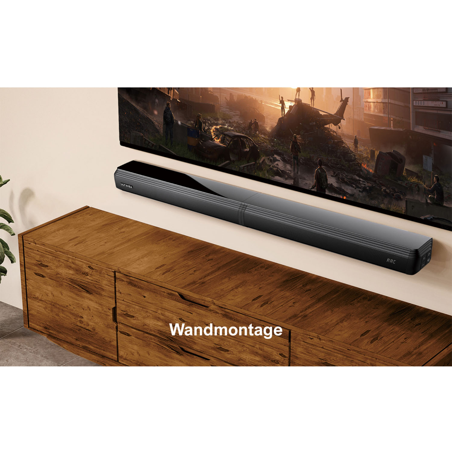 Schwarze Soundbar unter einem Fernseher an der Wand, über einem Holzschrank.