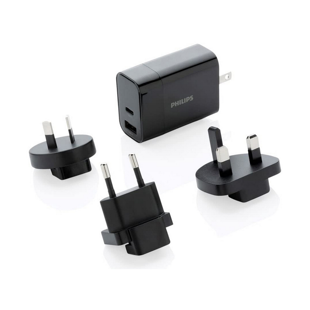 Zwarte oplader met meerdere adapters en het Philips-logo.
