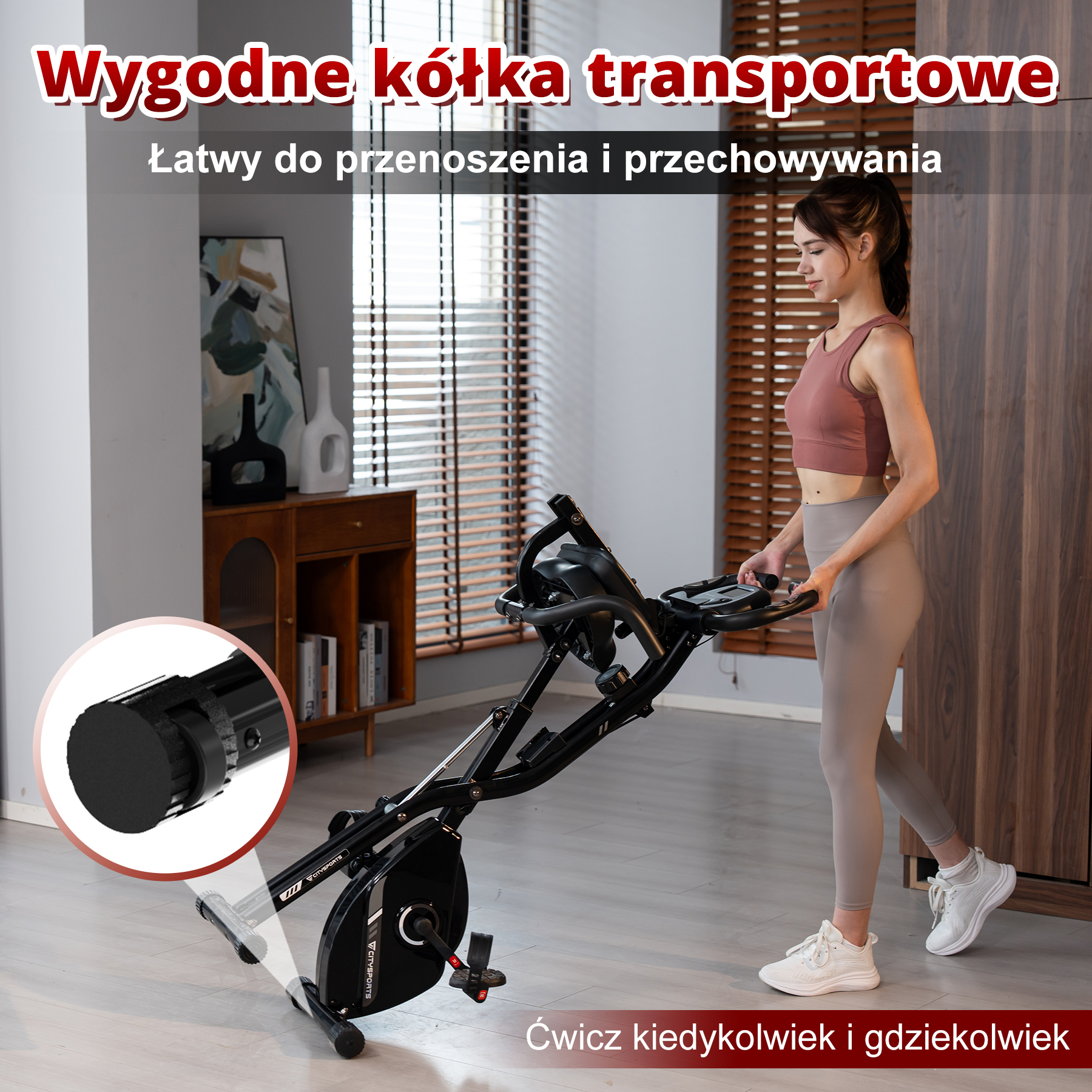 Kobieta przenosi rower stacjonarny. Skup się na kołach transportowych i konstrukcji roweru.