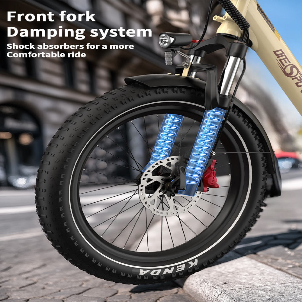 Ruota anteriore di una bici elettrica beige. Pneumatico nero, freno rosso e sospensione blu.