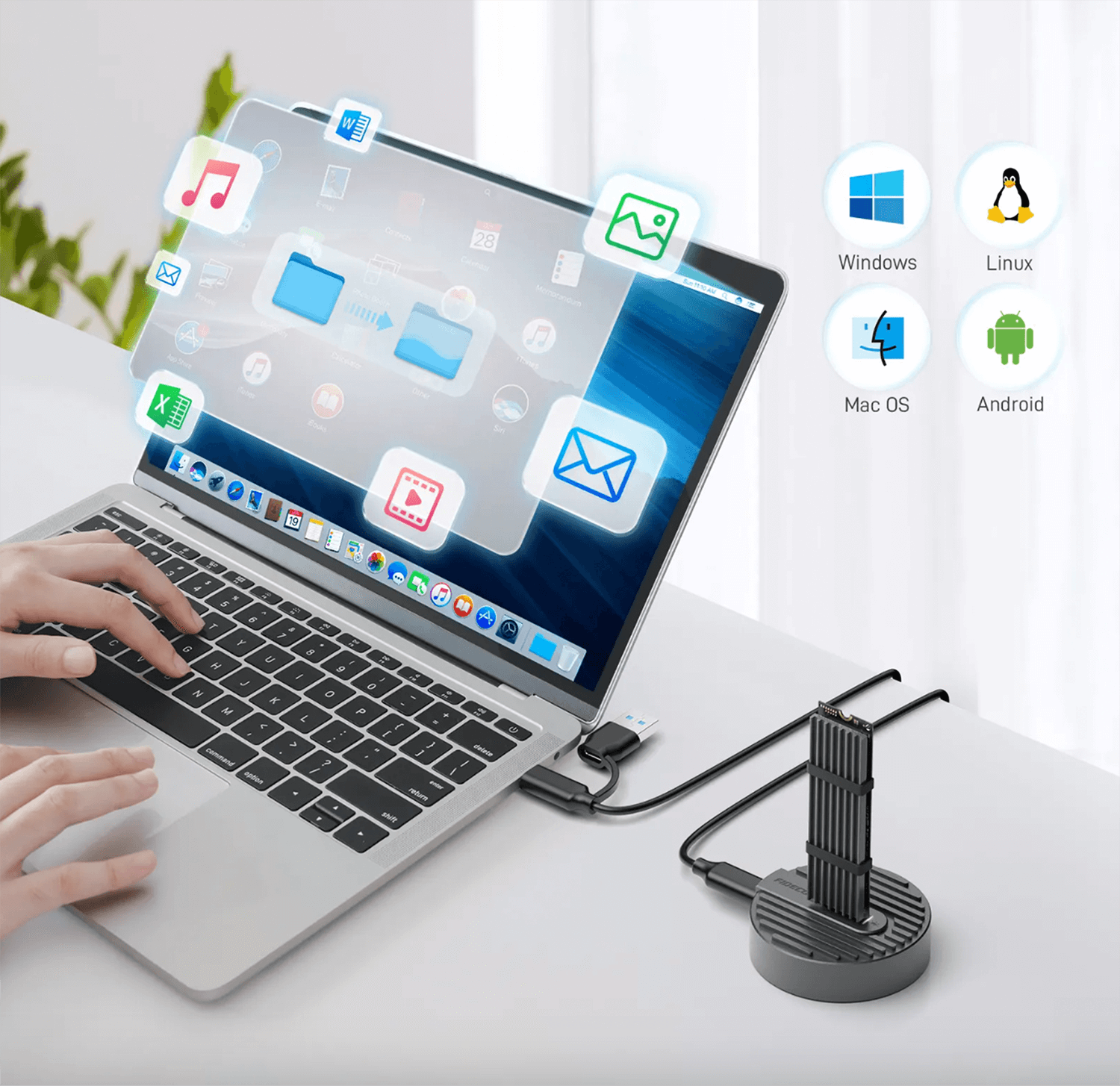 Laptop podłączony do urządzenia, z ikonami różnych systemów operacyjnych.