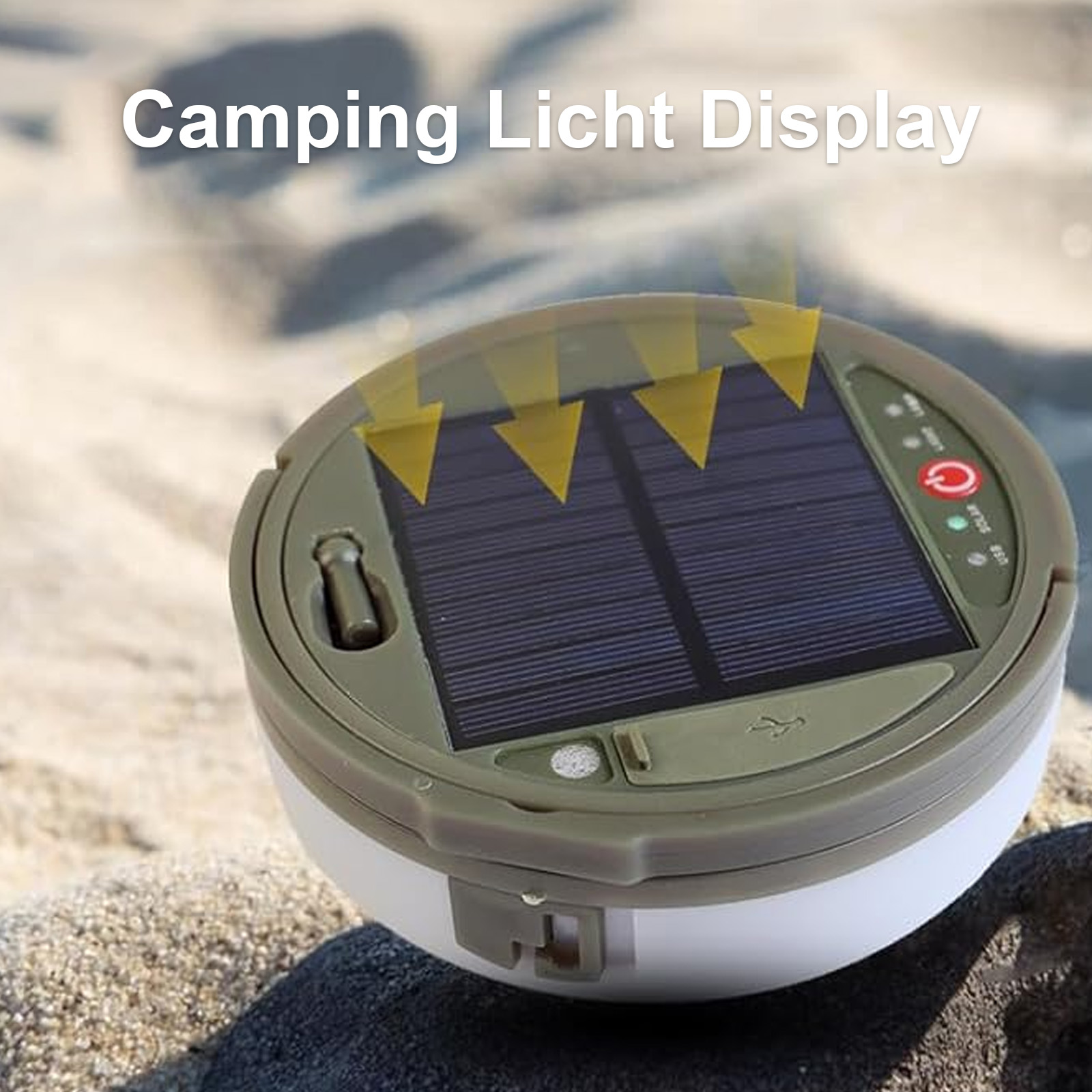 Eine Solar-Camping-Leuchte mit Solarpanel, USB-Anschluss und Lichtanzeigen. Sie liegt auf sandigem Untergrund.