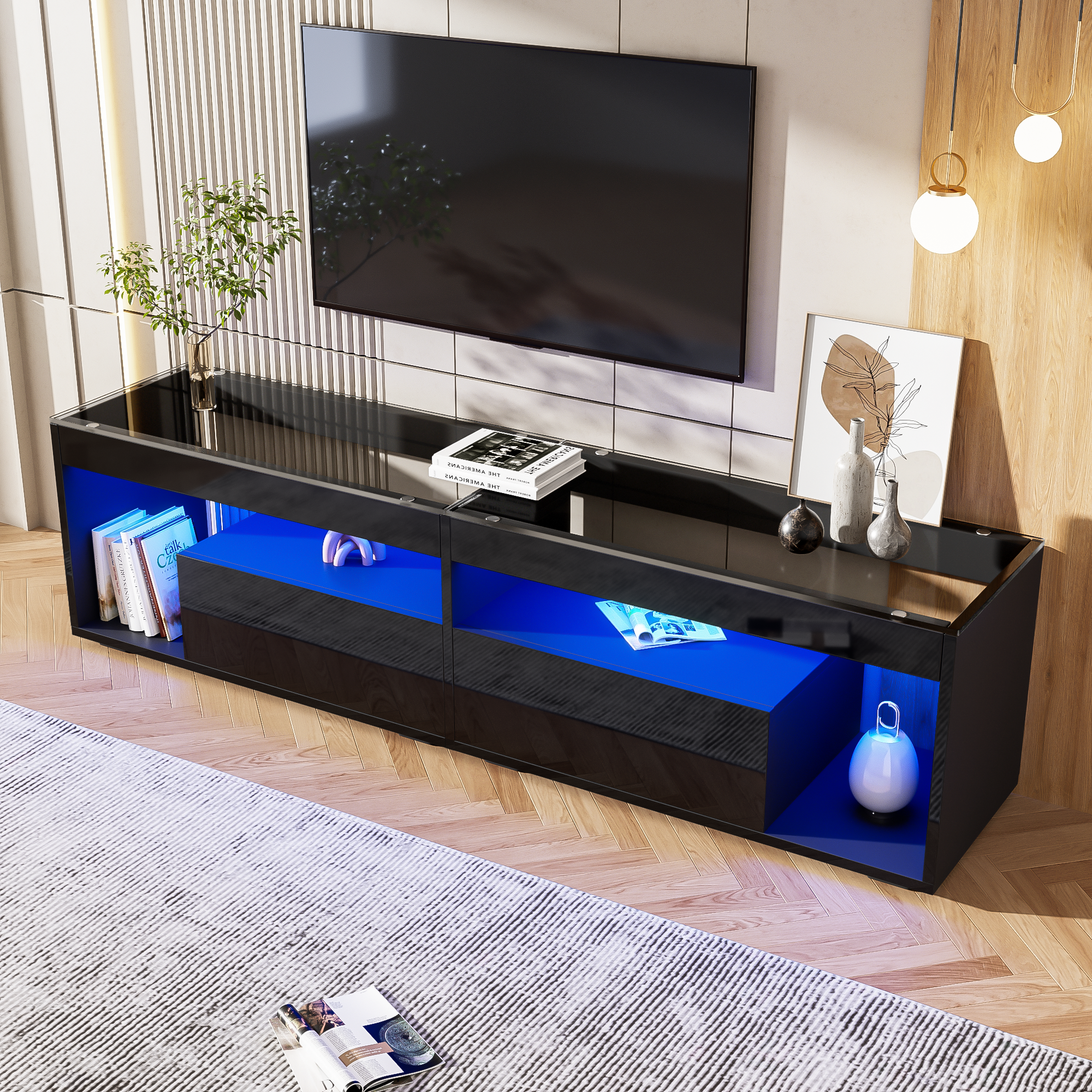 Schwarzer TV-Ständer mit blauen Lichtern, TV oben und Dekoration.