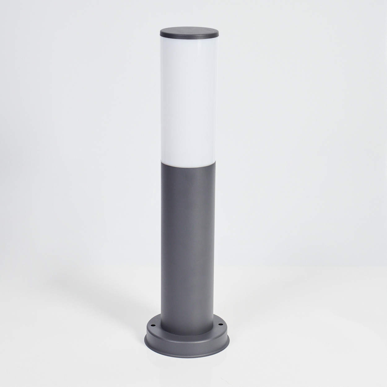 Graue zylindrische Lampe mit weißem Oberteil und kreisförmiger Basis.