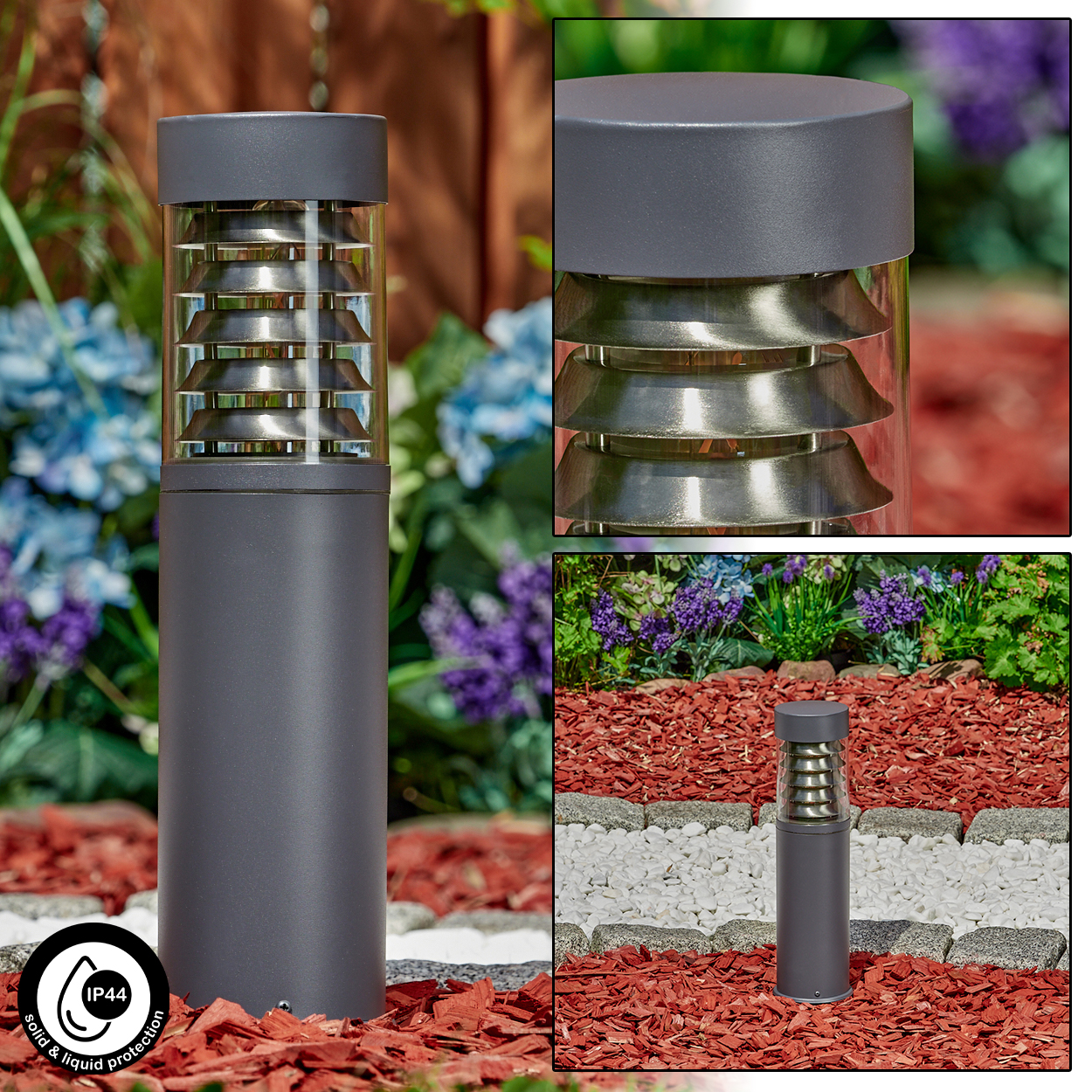 Dunkelgraue Außenlampe mit horizontalen Metalllamellen. In einem Garten mit roter Mulch und Blumen.