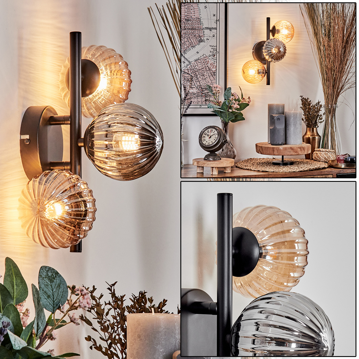 Wandlampe mit drei gläsernen, blasenartigen Glühbirnen, schwarzem Rahmen, weißem Hintergrund.