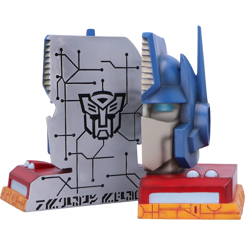 Optimus Prime-figuur met een Transformers-logo op een grijze achtergrond en een rode basis.
