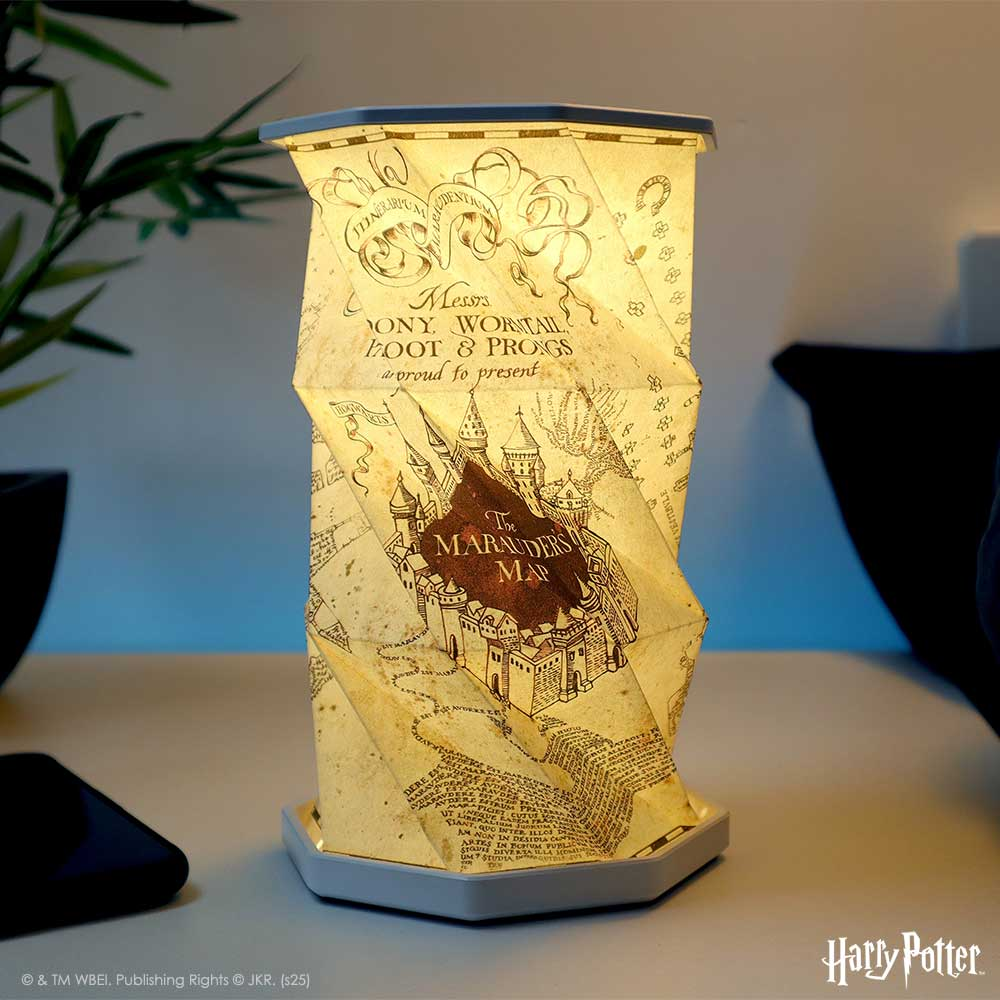 A cylindrical lamp with a map design from the Marauders. 