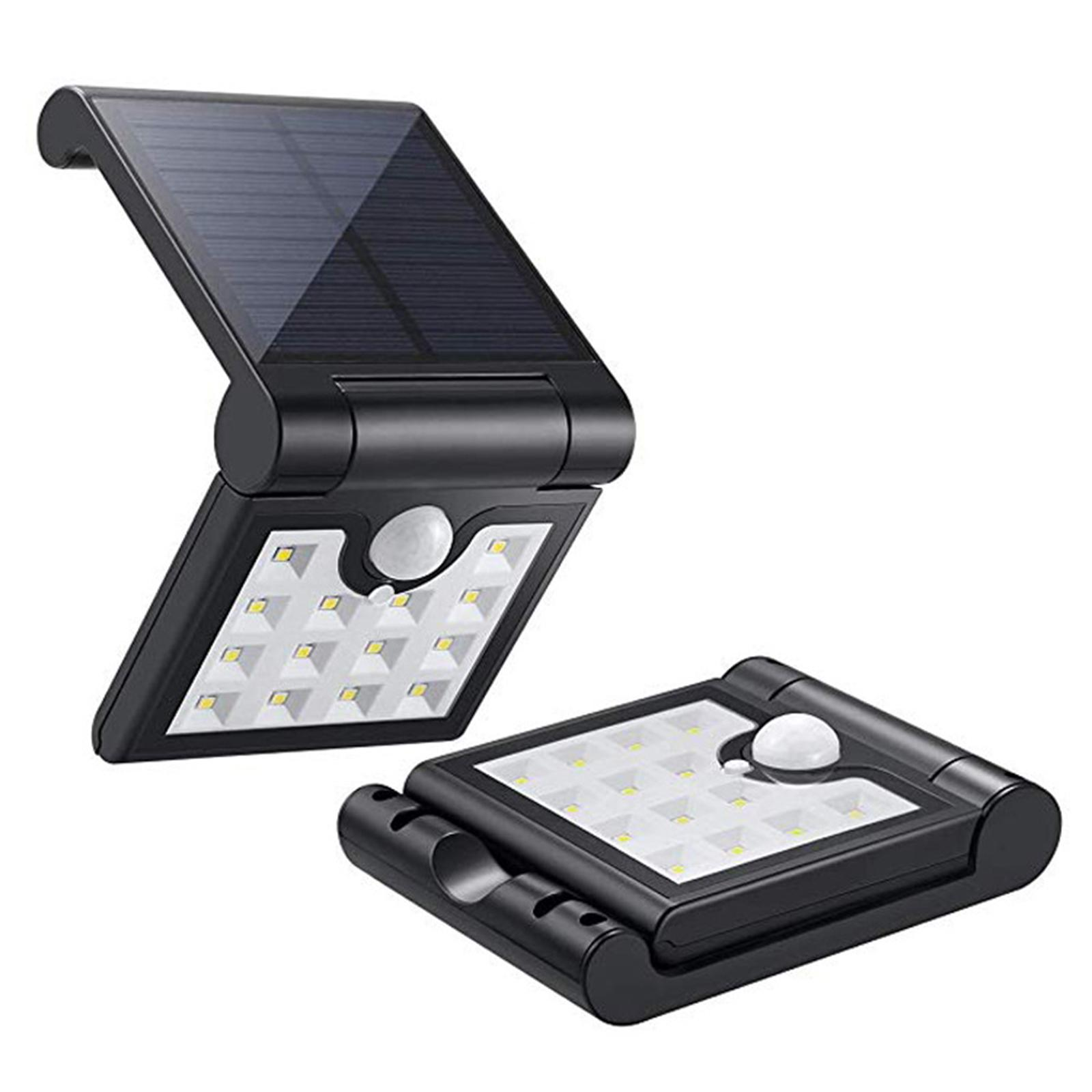 Zwei schwarze Solarleuchten. Jede Leuchte hat ein Panel und Lichter, für die Anzeige abgewinkelt.