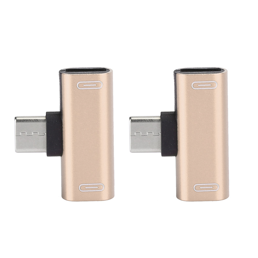 Zwei goldene USB-C-Adapter. Jeder Adapter hat einen USB-C-Anschluss und einen USB-C-Stecker im rechten Winkel.