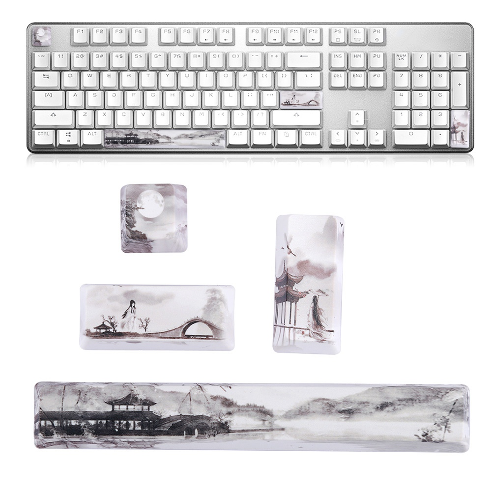 Eine weiße Tastatur und dazugehörige Tastenkappen, eine Handballenauflage und Tastaturzubehör mit asiatischem Thema.