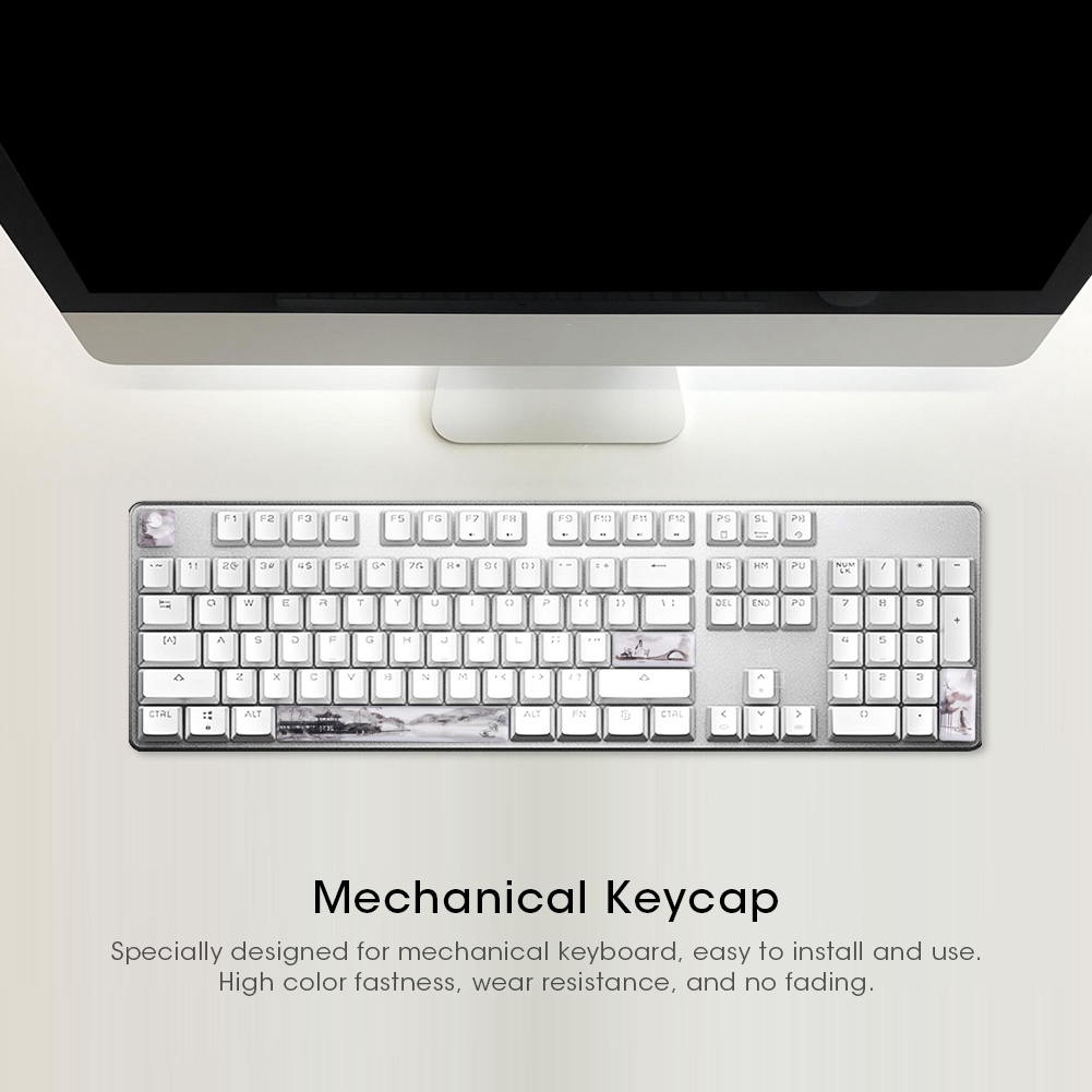 Eine weiße Tastatur mit einem Computerbildschirm, einer Maus und verschiedenen Objekten.