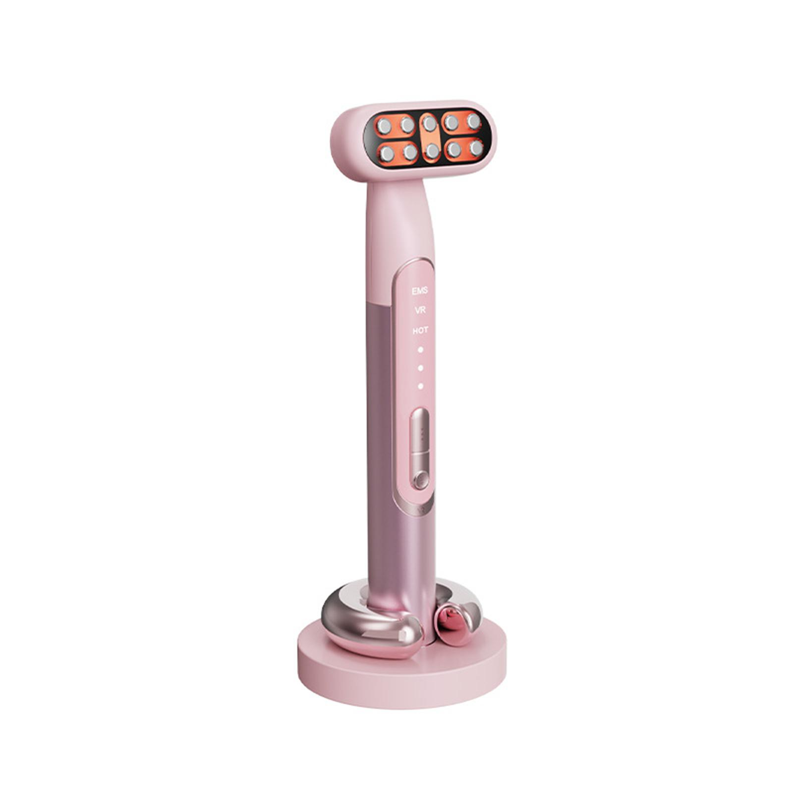 Rosa Gesichtsmassagegerät auf einem Ständer. Es hat einen rollenden Kopf und Knöpfe.