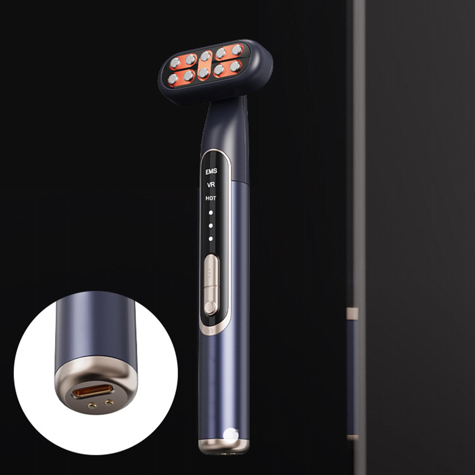Dunkelblauer Gesichtsmassager mit orangen Lichtern am Kopf. EMS, VR und HOT-Tasten am Griff.