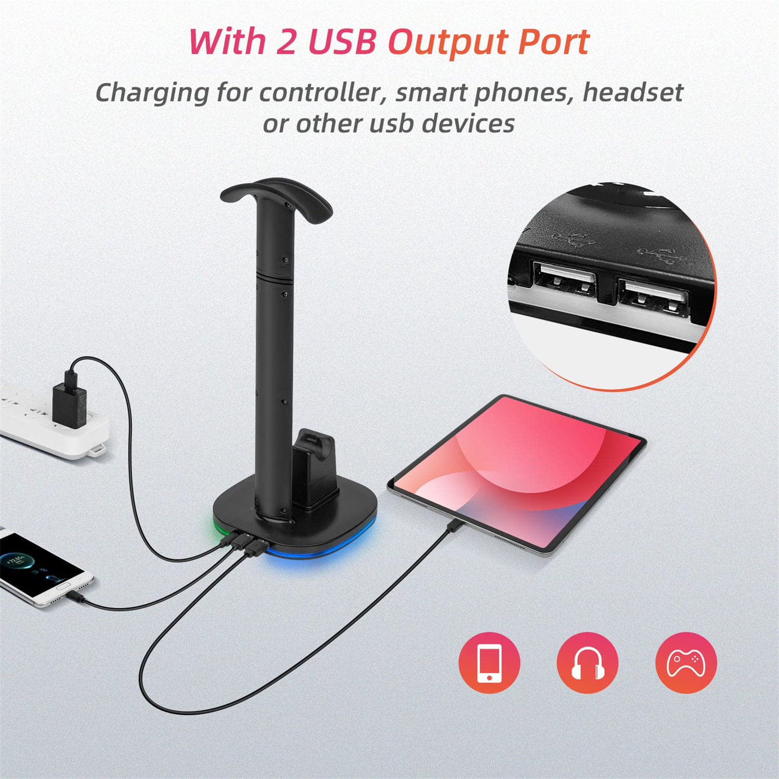 Schwarzer Headset-Ständer mit Tablet und Telefon, die geladen werden. USB-Anschlüsse sichtbar. Text: mit 2 USB-Ausgängen.