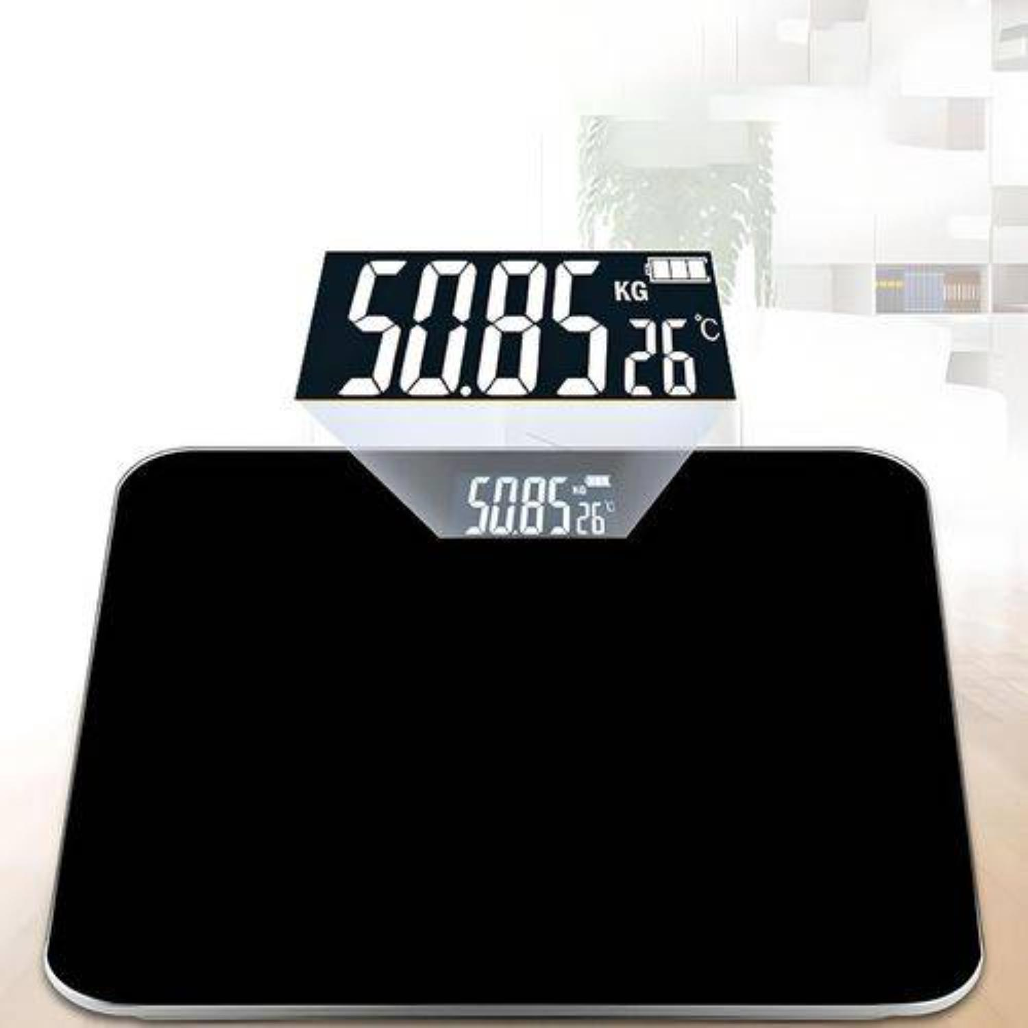 Schwarze Digitalwaage, abgewinkeltes Display mit 50,85 kg und 26°C.
