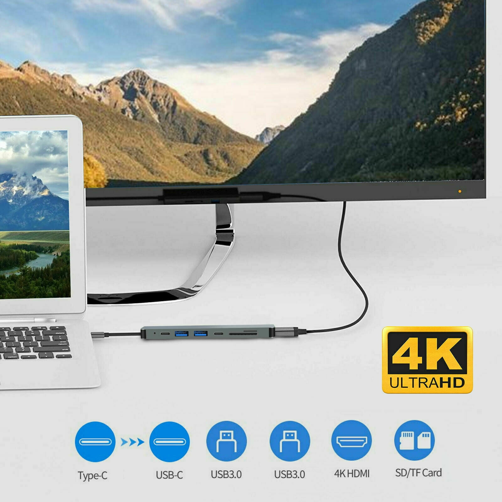 Laptop an USB-Hub und Monitor angeschlossen. Der Hub zeigt verschiedene Port-Verbindungen.