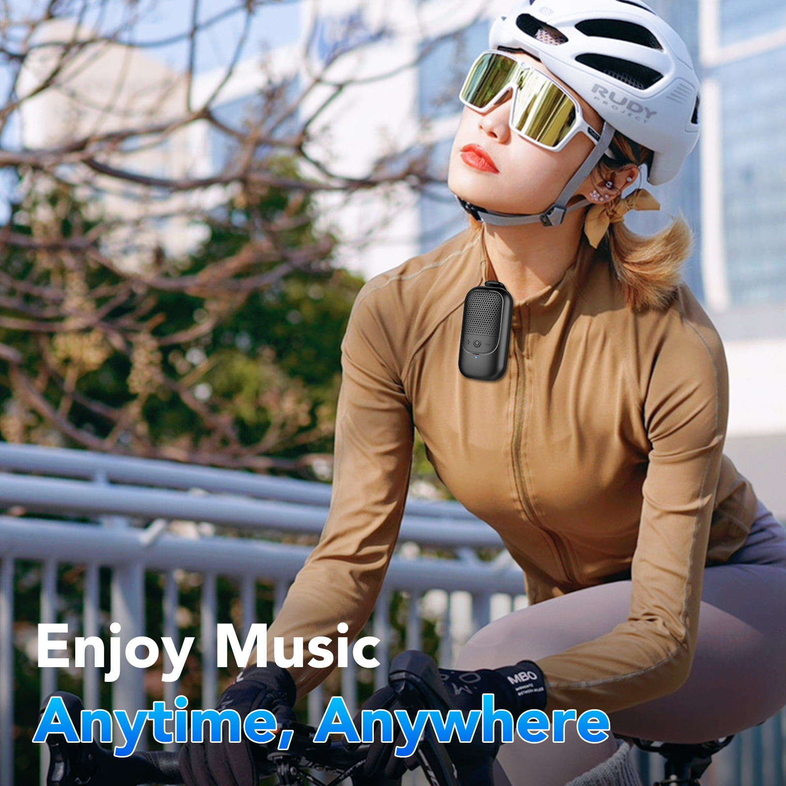 Frau auf dem Fahrrad mit Sonnenbrille und Helm. Text lautet 'Enjoy Music Anytime, Anywhere'.