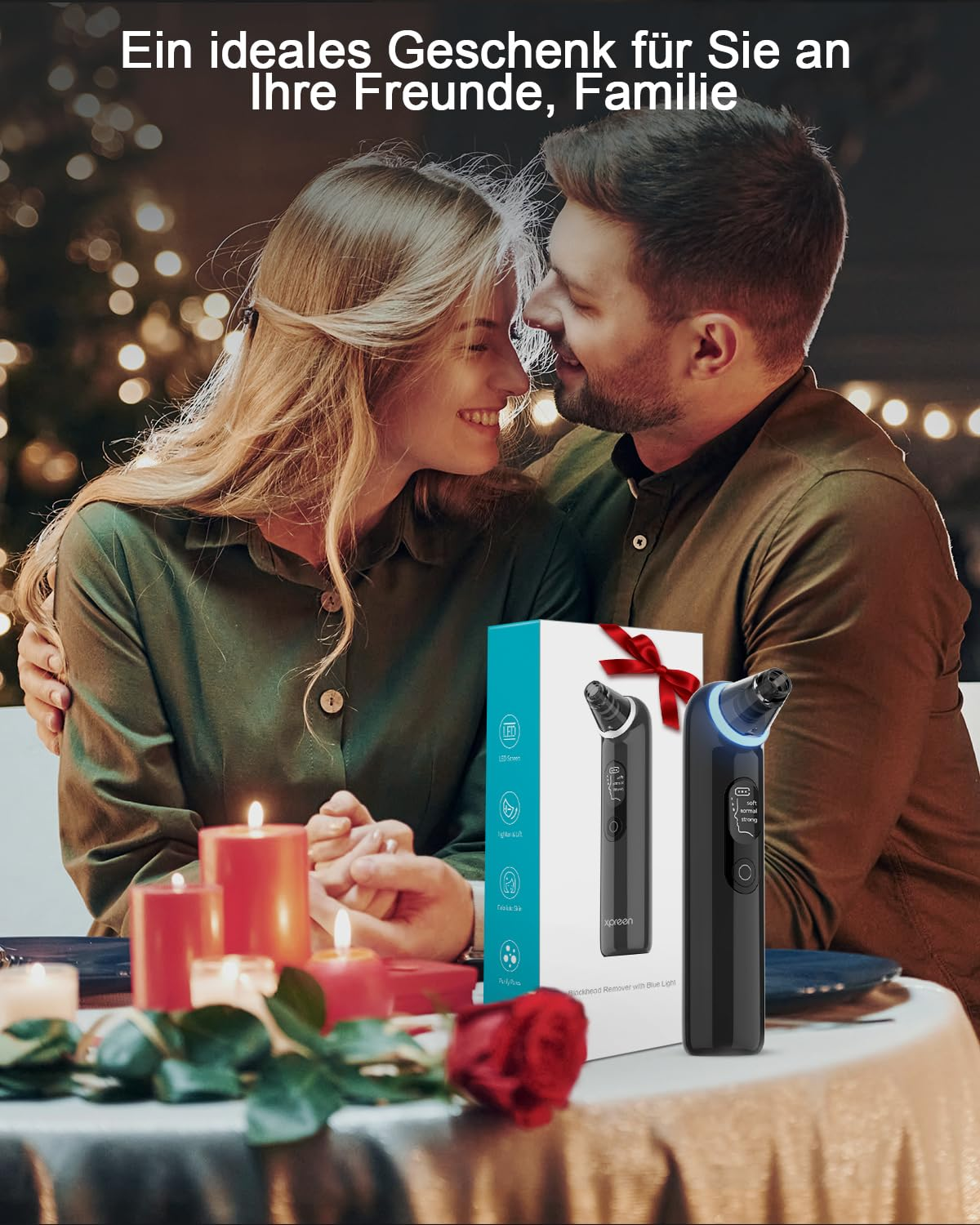 Paar in der Nähe von Kerzen, hält eine Geschenkbox mit einem schwarzen Gerät.