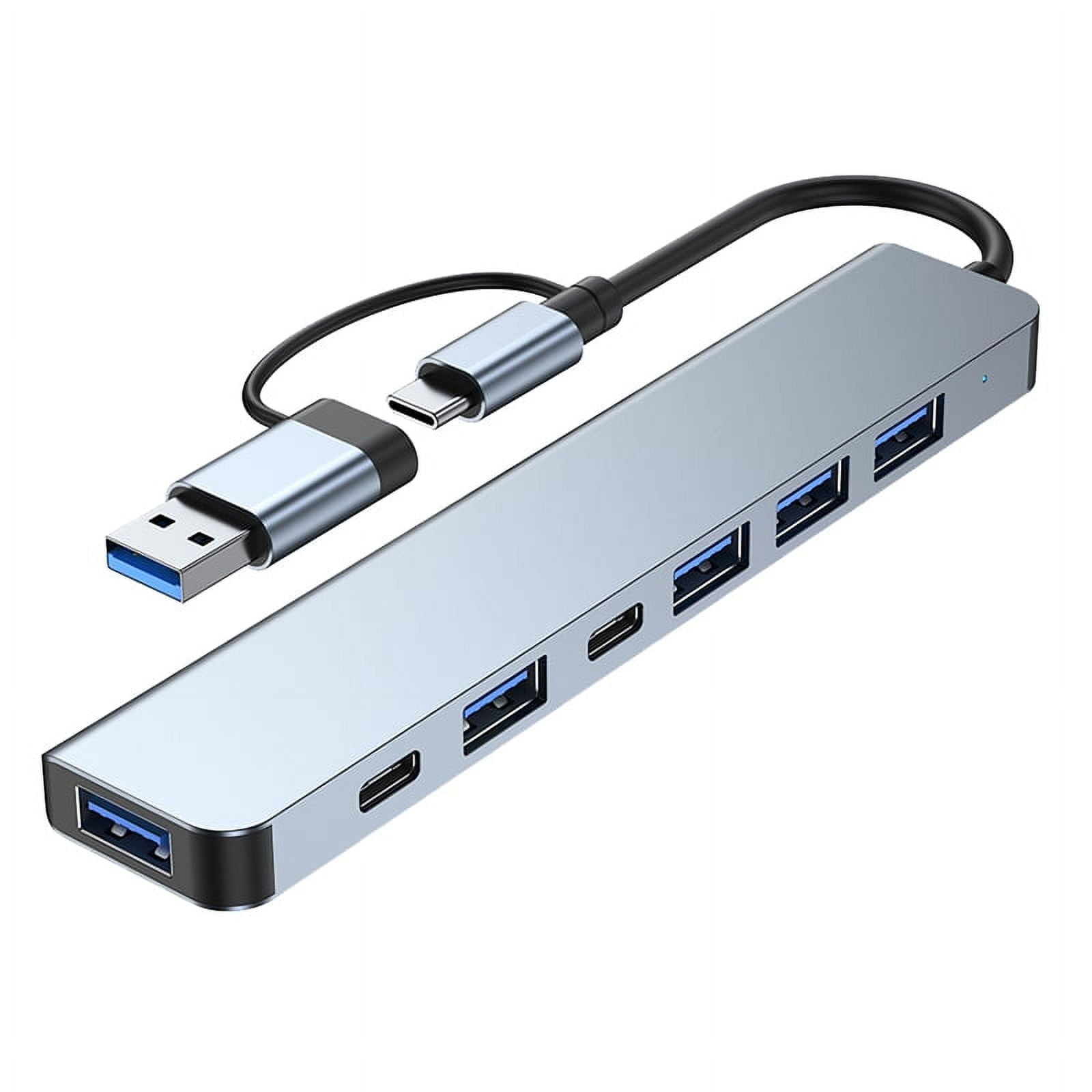 Ein silberner und blauer USB-Hub mit mehreren Anschlüssen. USB- und USB-C-Anschlüsse.