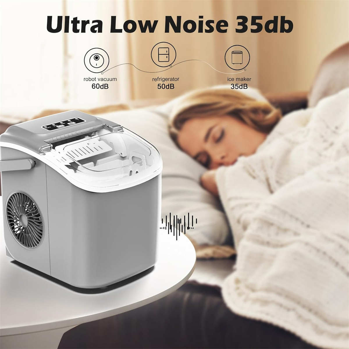 Ein Eisbereiter auf einem Tisch mit einer schlafenden Frau im Hintergrund. Es steht Ultra Low Noise 35db.