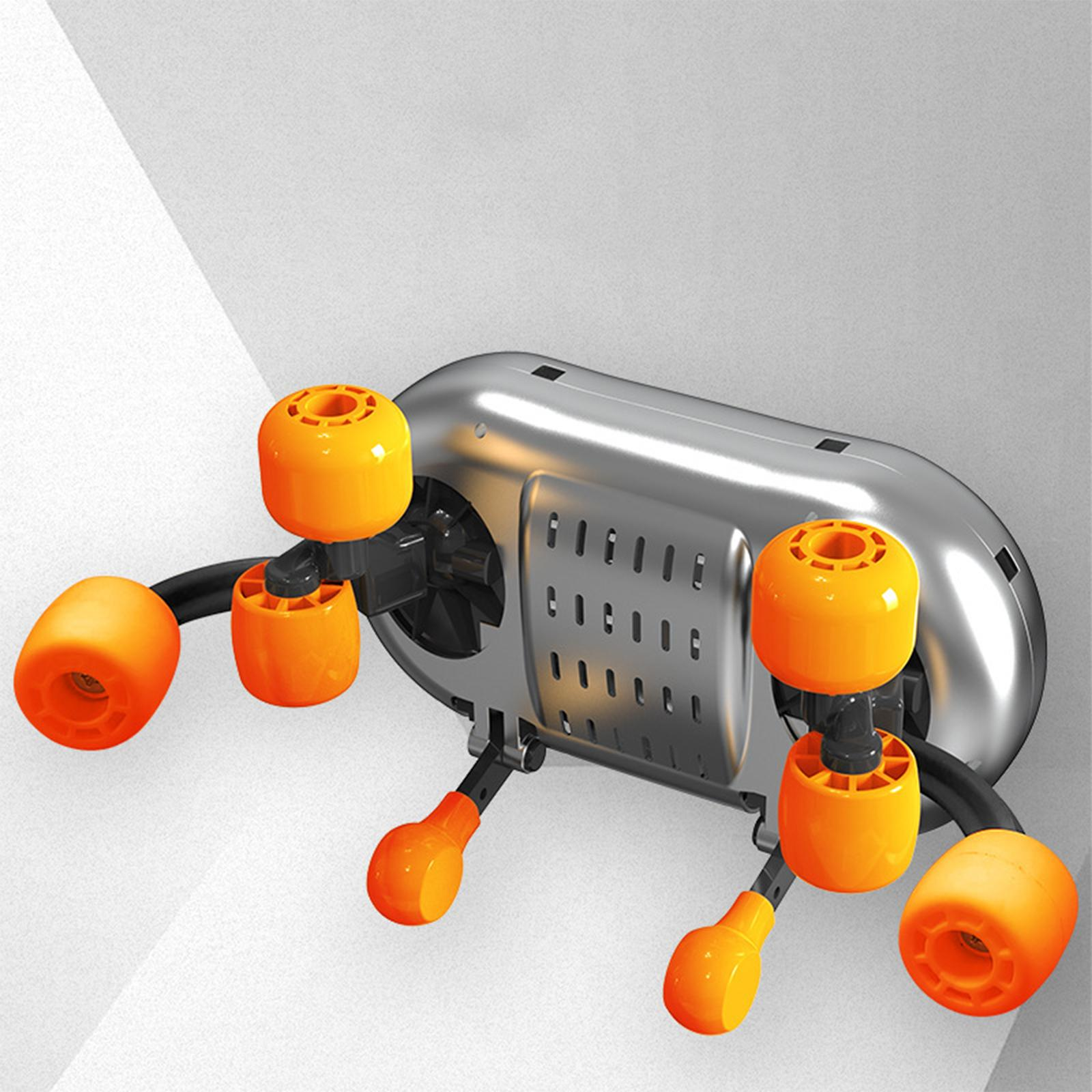 Silbernes Gerät mit orangefarbenen Rädern. Das Gerät hat eine metallische Oberfläche mit mehreren orangefarbenen Rädern.