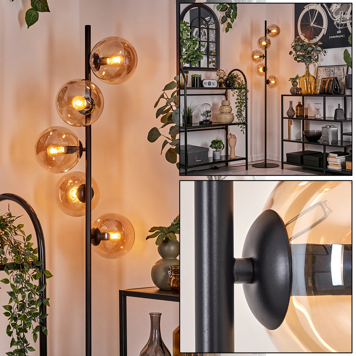 Eine Stehlampe mit Glaskugeln und Pflanzen.