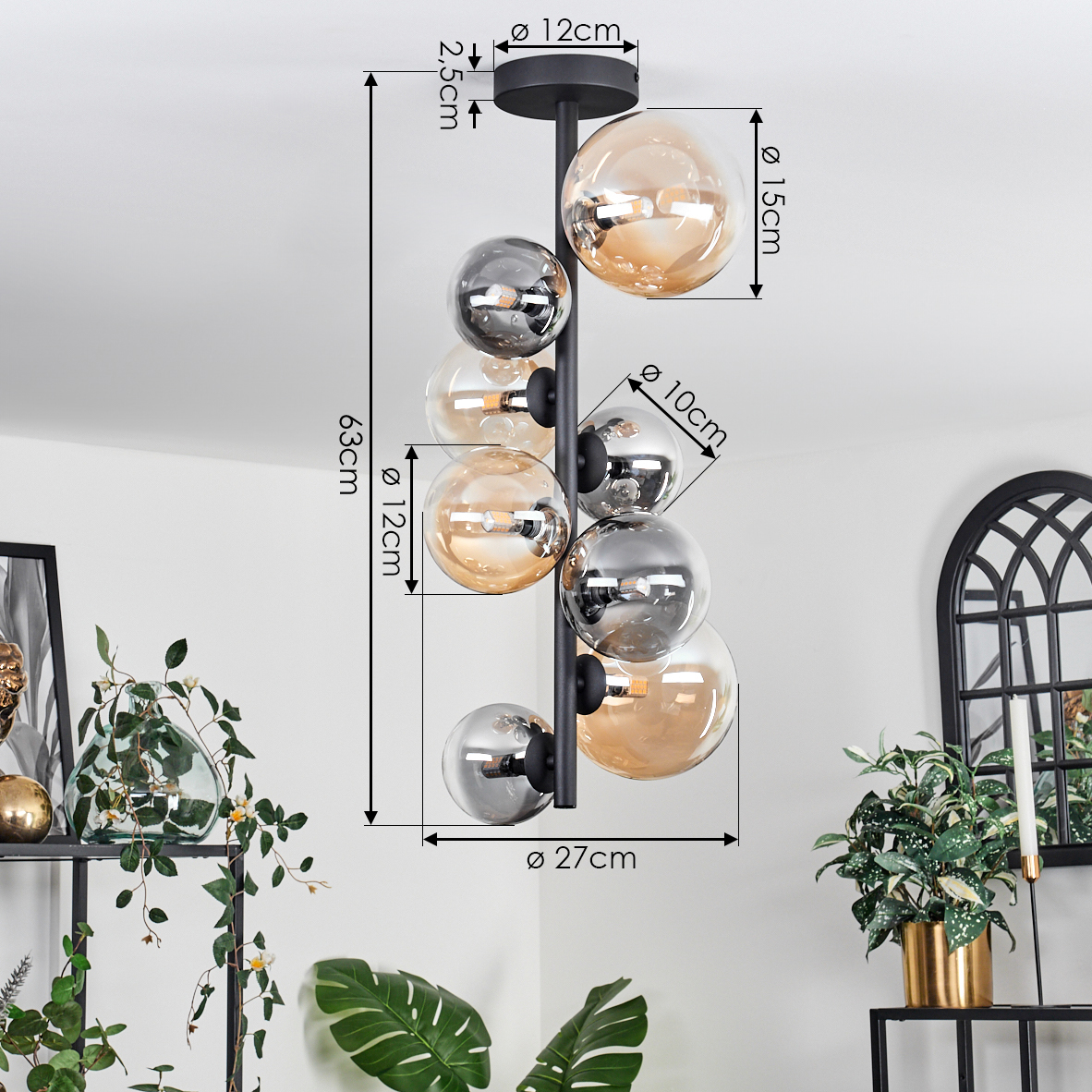 Nahaufnahme einer schwarzen Lampe mit bernsteinfarbenen und silbernen Glaskugeln. Abmessungen angegeben.