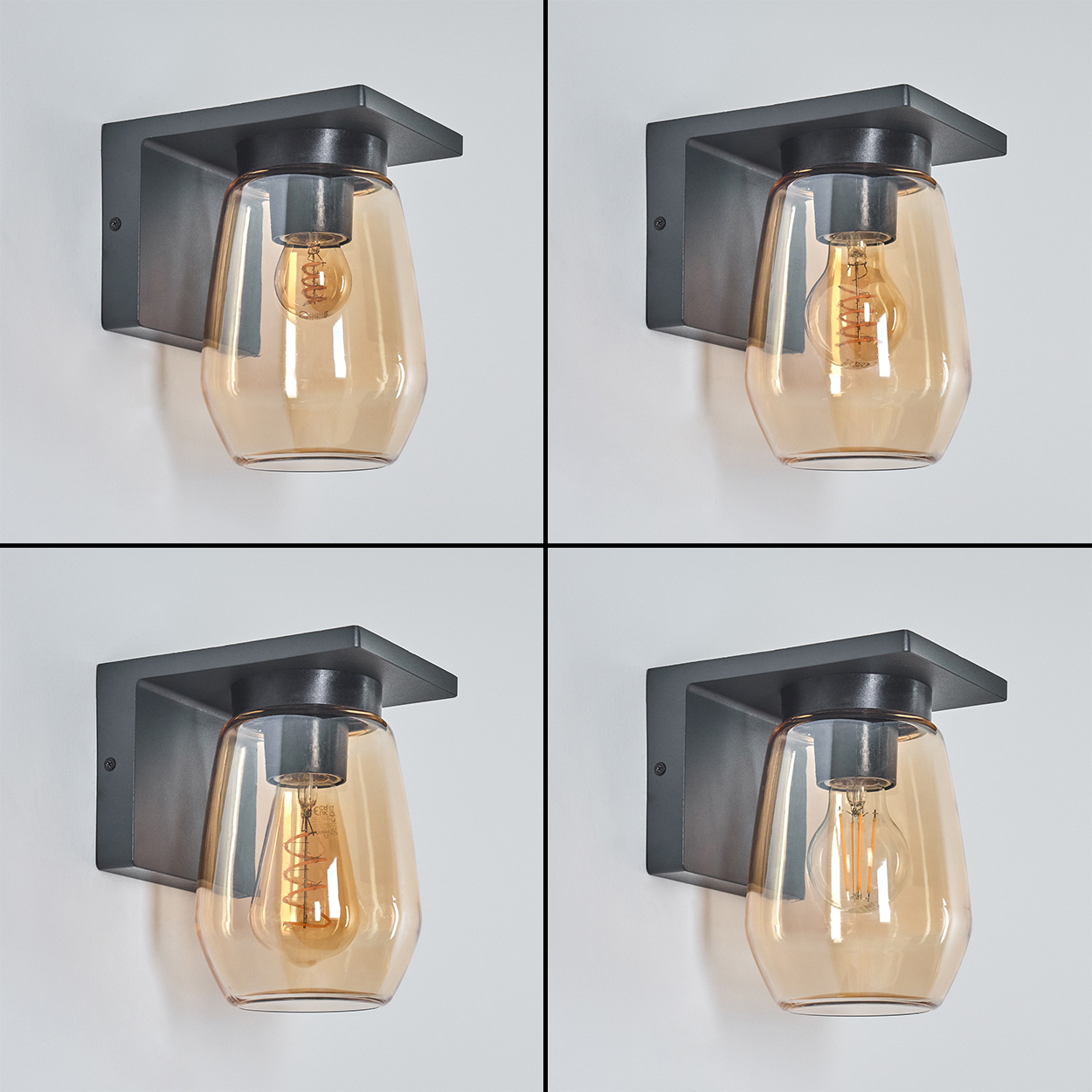 Eine Serie von vier schwarzen Wandleuchten mit goldenen, tropfenförmigen Glasschirmen, mit verschiedenen Glühbirnen.