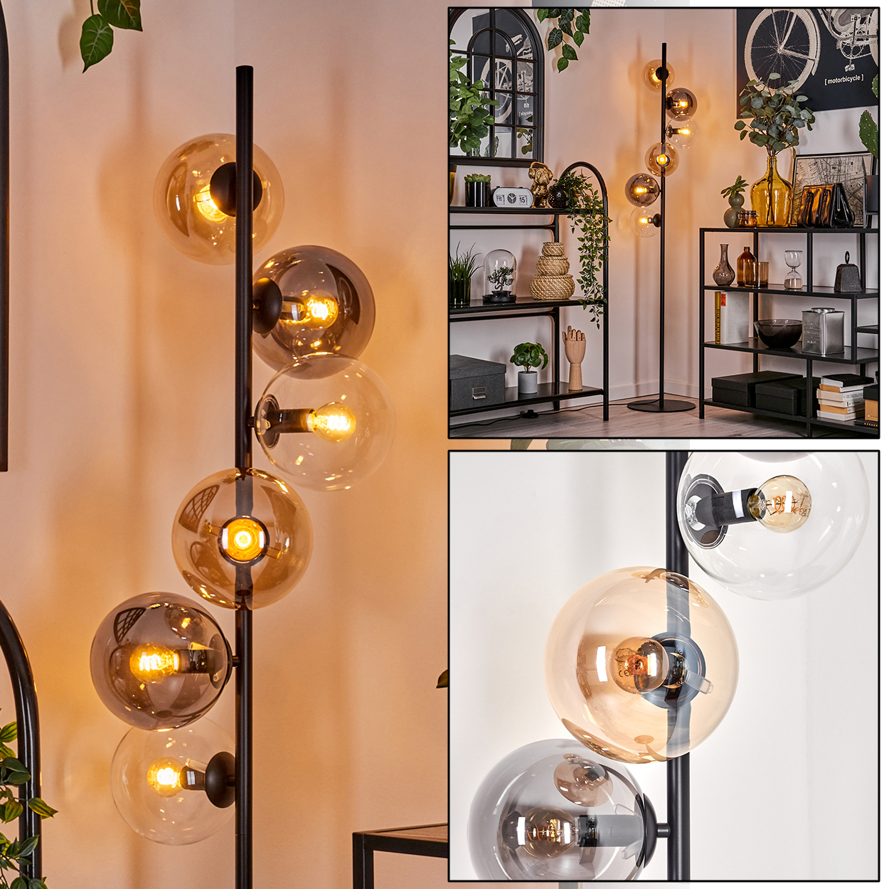 Schwarze Stehlampe mit bernsteinfarbenen Glaskugeln und sichtbaren Glühbirnen, vor weißer Wand.