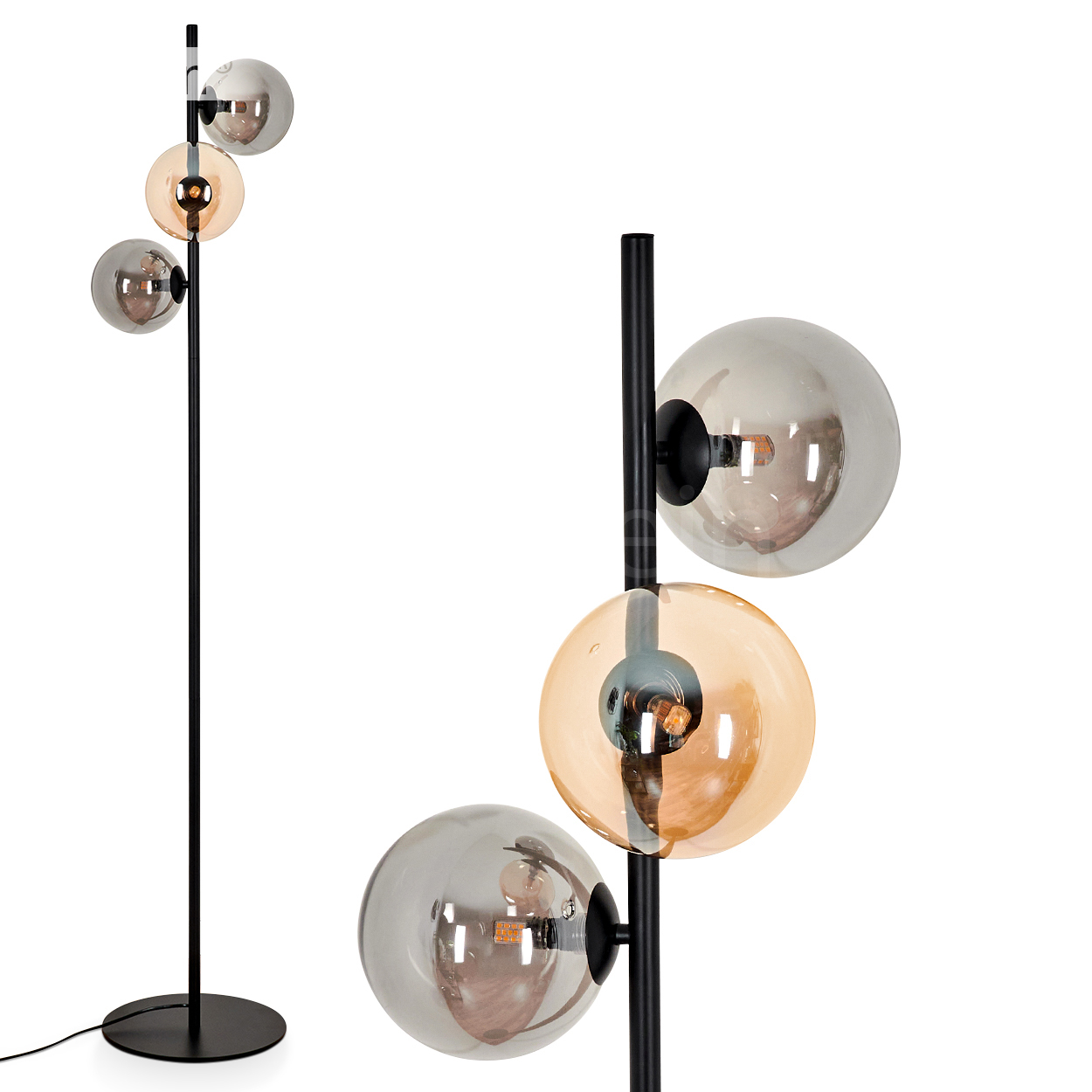 Stehlampe mit drei Kugelleuchten mit schwarzem Ständer auf weißem Hintergrund. Eine mit bernsteinfarbenem Glas.