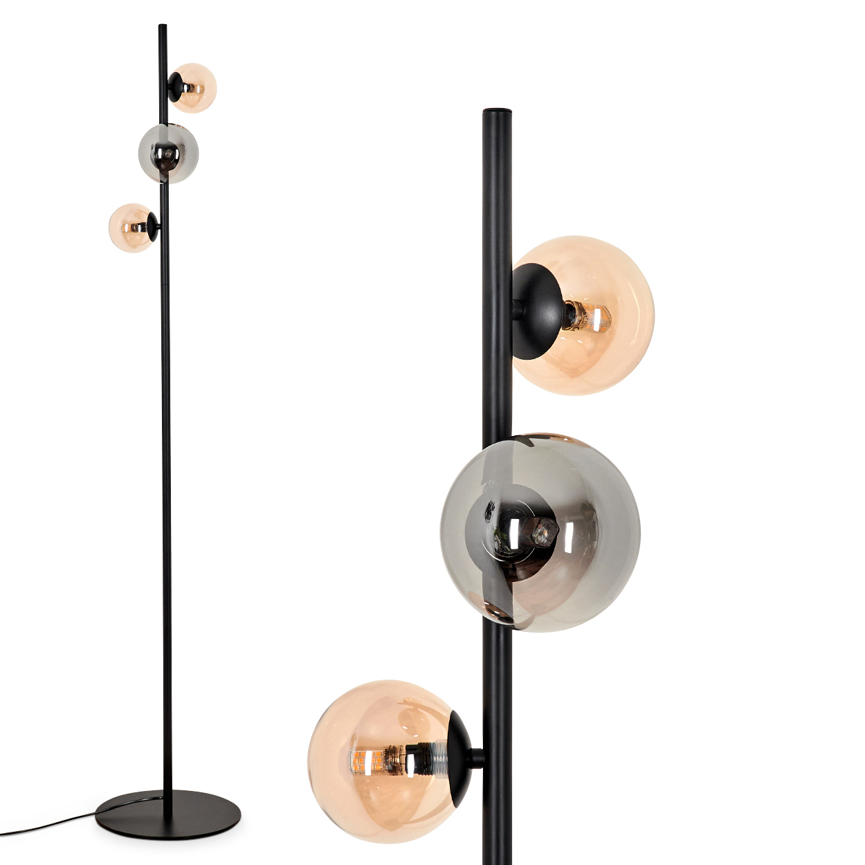 Schwarze Stehlampe mit bernsteinfarbenen und silbernen Glaskugeln auf weißem Grund.