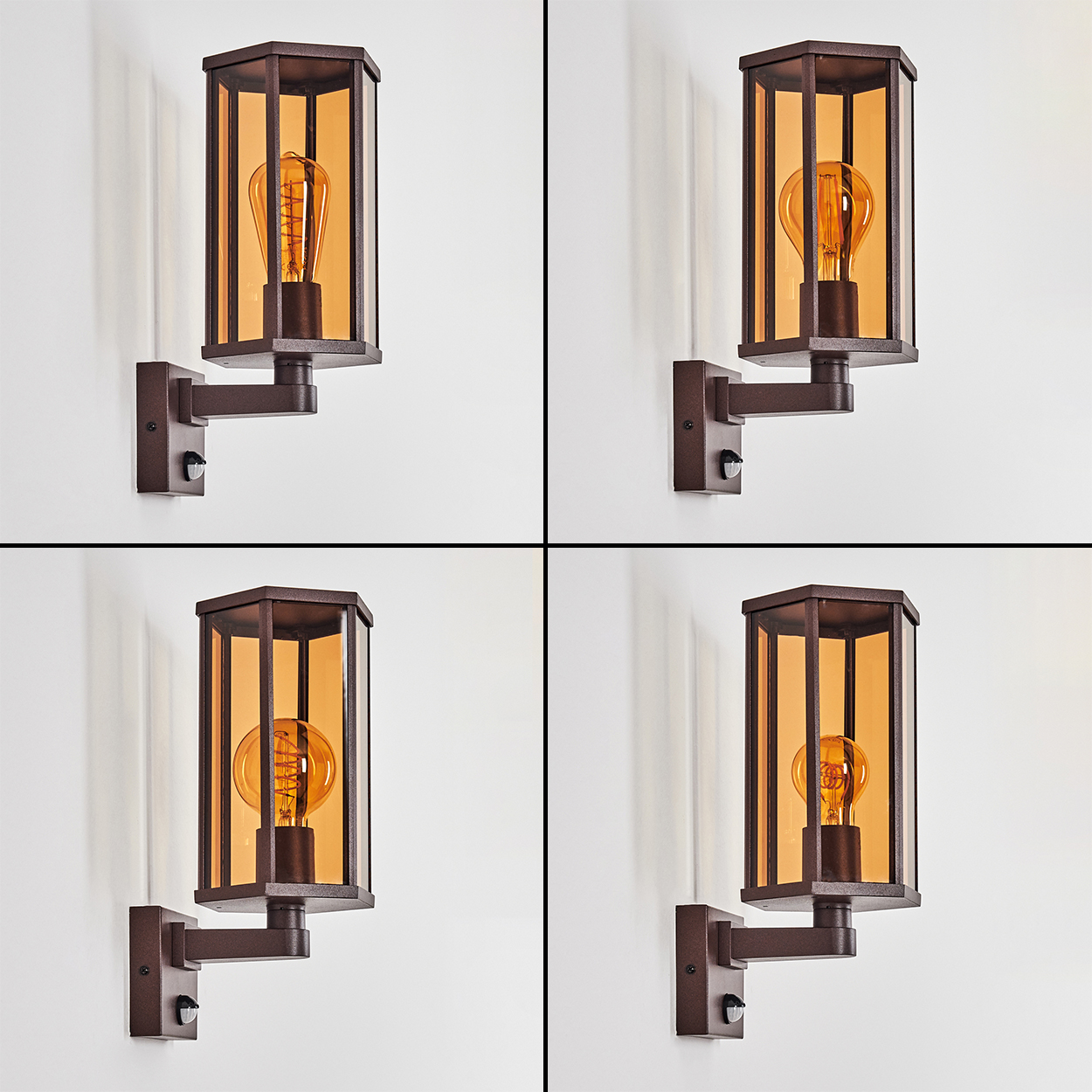 Vier identische braune Wandlampen mit bernsteinfarbenem Glas und sichtbaren Glühbirnen.