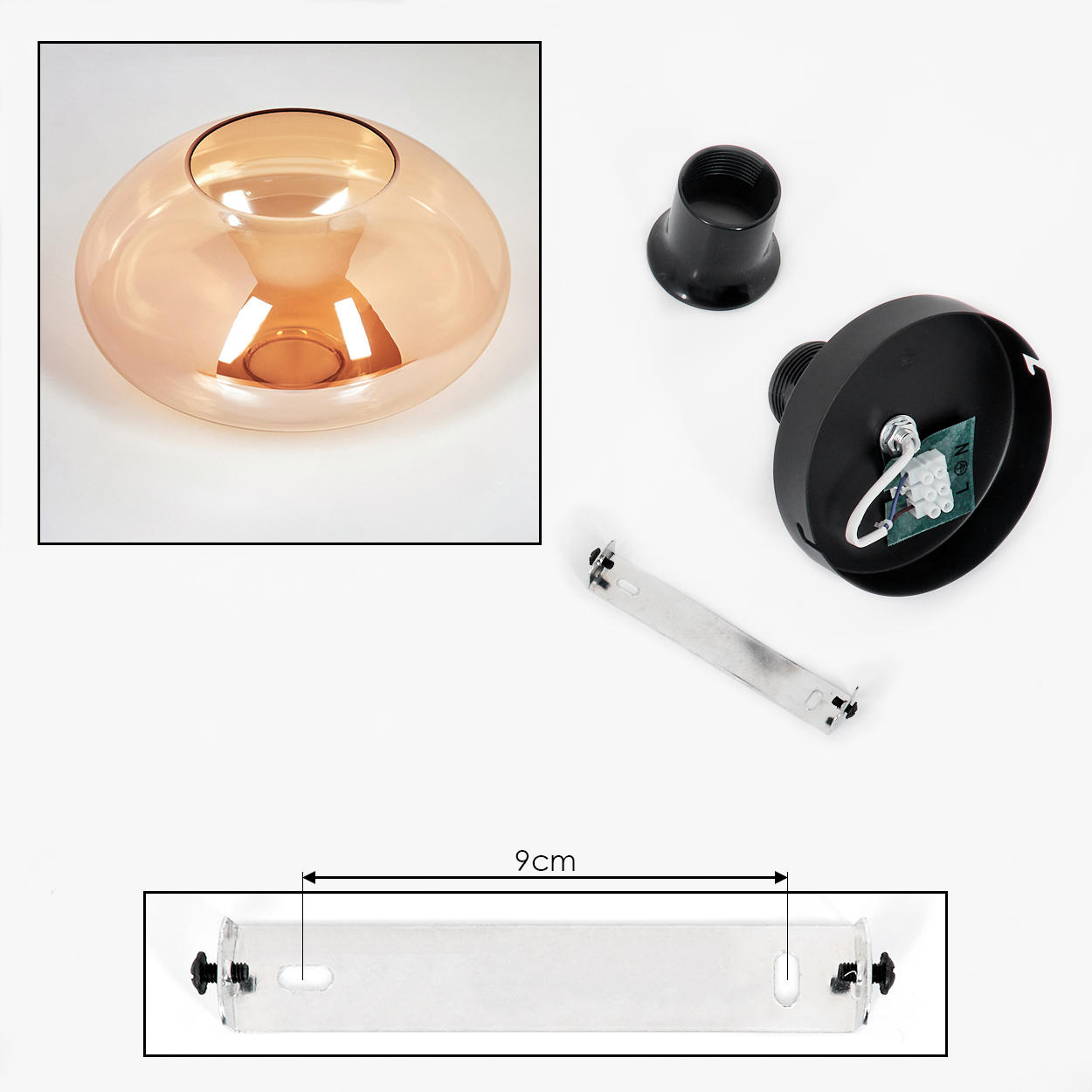 Lampenteile: bernsteinfarbener Glasschirm, schwarze Halterung, Metallhalterung. Weißer Hintergrund.