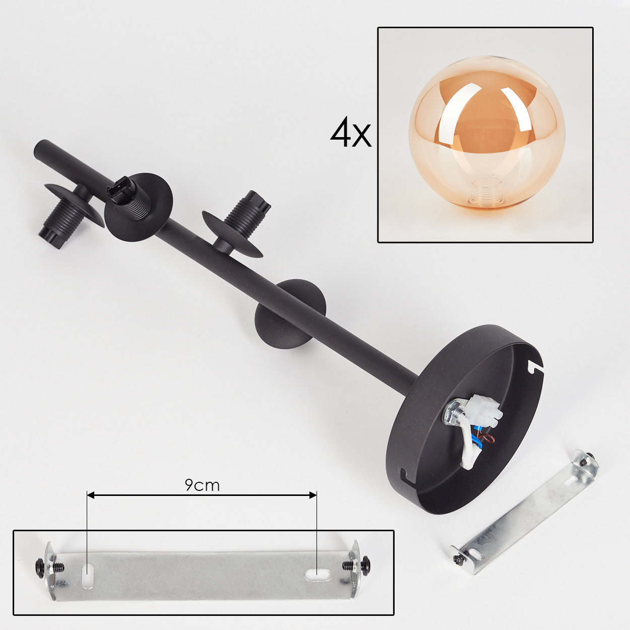 Komponenten einer schwarzen Deckenlampe mit bernsteinfarbenen Glaskugeln. Enthält Befestigungsmaterial und einen zusätzlichen Globus.