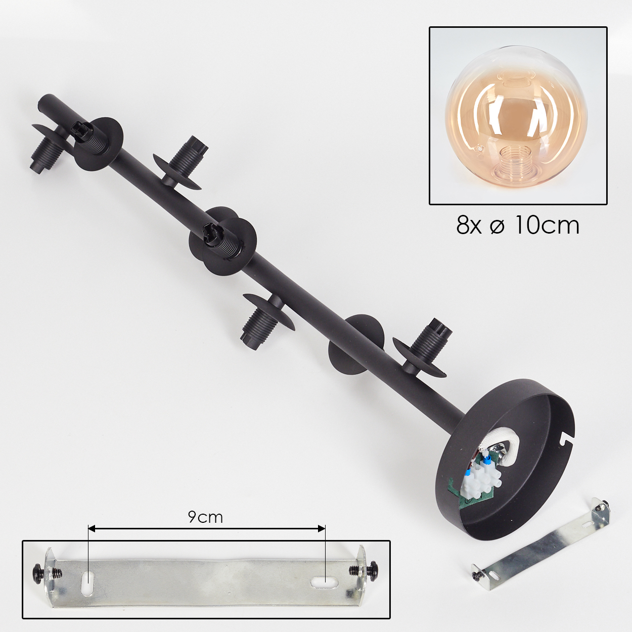 Komponenten einer Lampe. Eine schwarze Stange mit Fassungen, ein Sockel und eine kleine Metallhalterung.