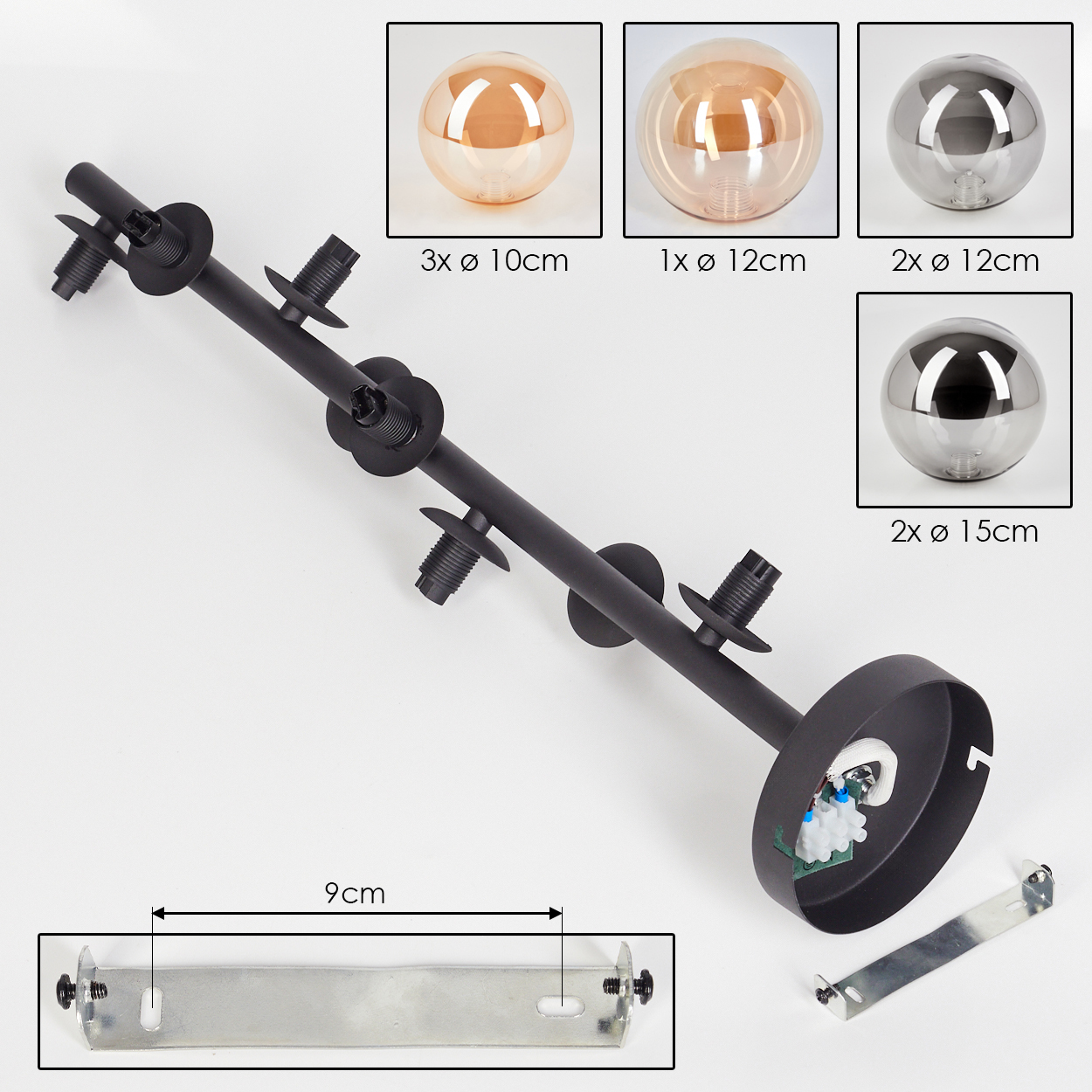 Teile einer Deckenlampe. Schwarze Basis, Montagehalterung, Glaskugeln in verschiedenen Größen.