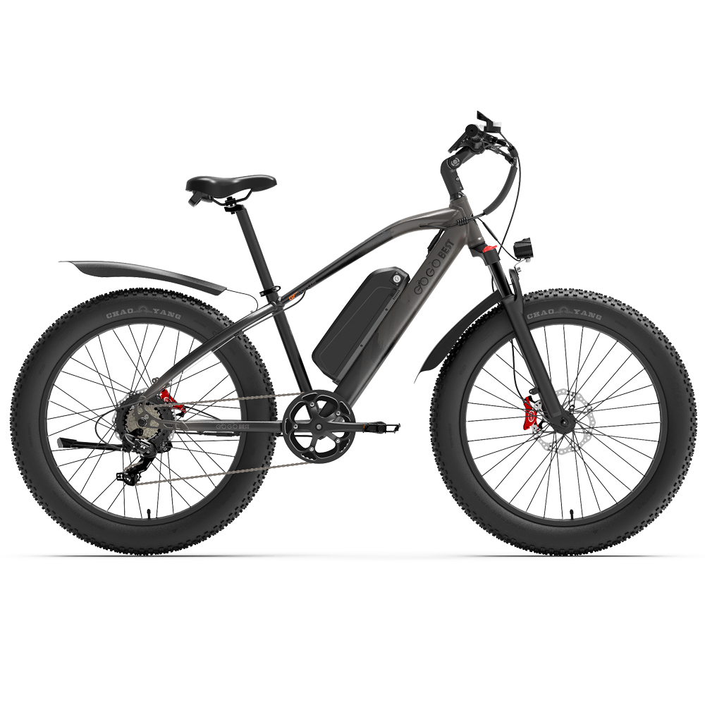 Bicicletta elettrica grigia con pneumatici neri larghi su sfondo bianco, rivolta a sinistra.