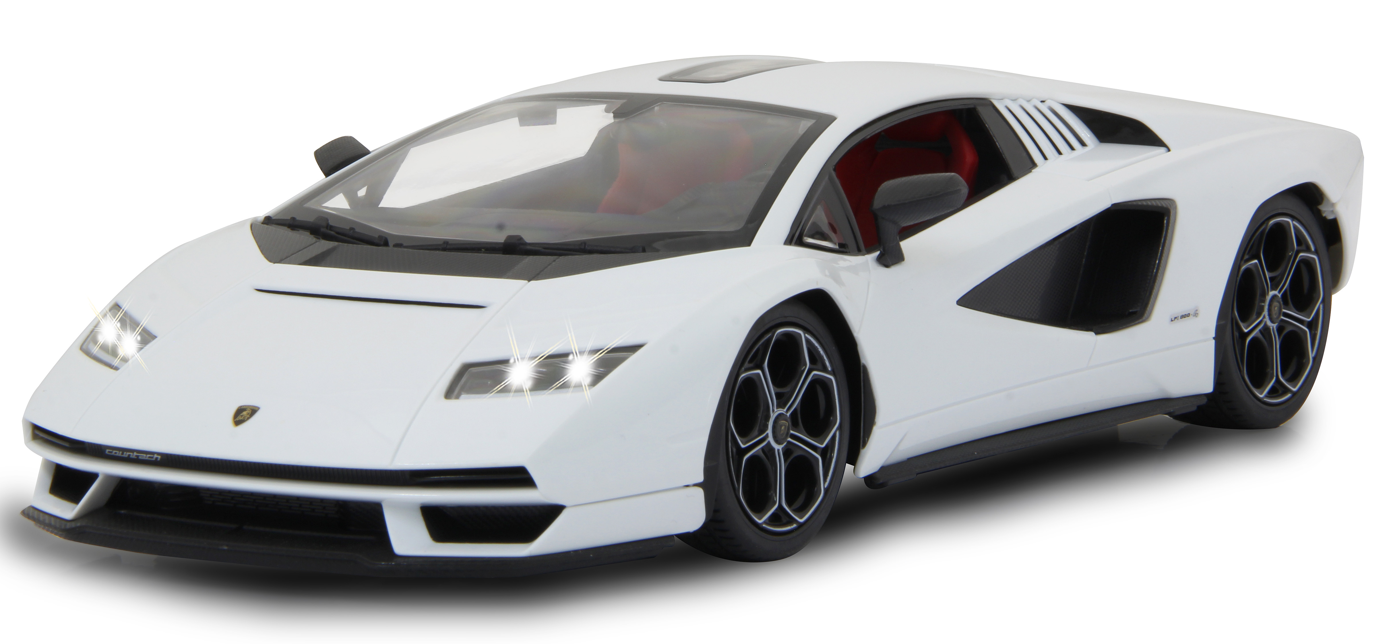 Weißes Lamborghini Countach Auto mit eingeschalteten Lichtern, von der Seite.