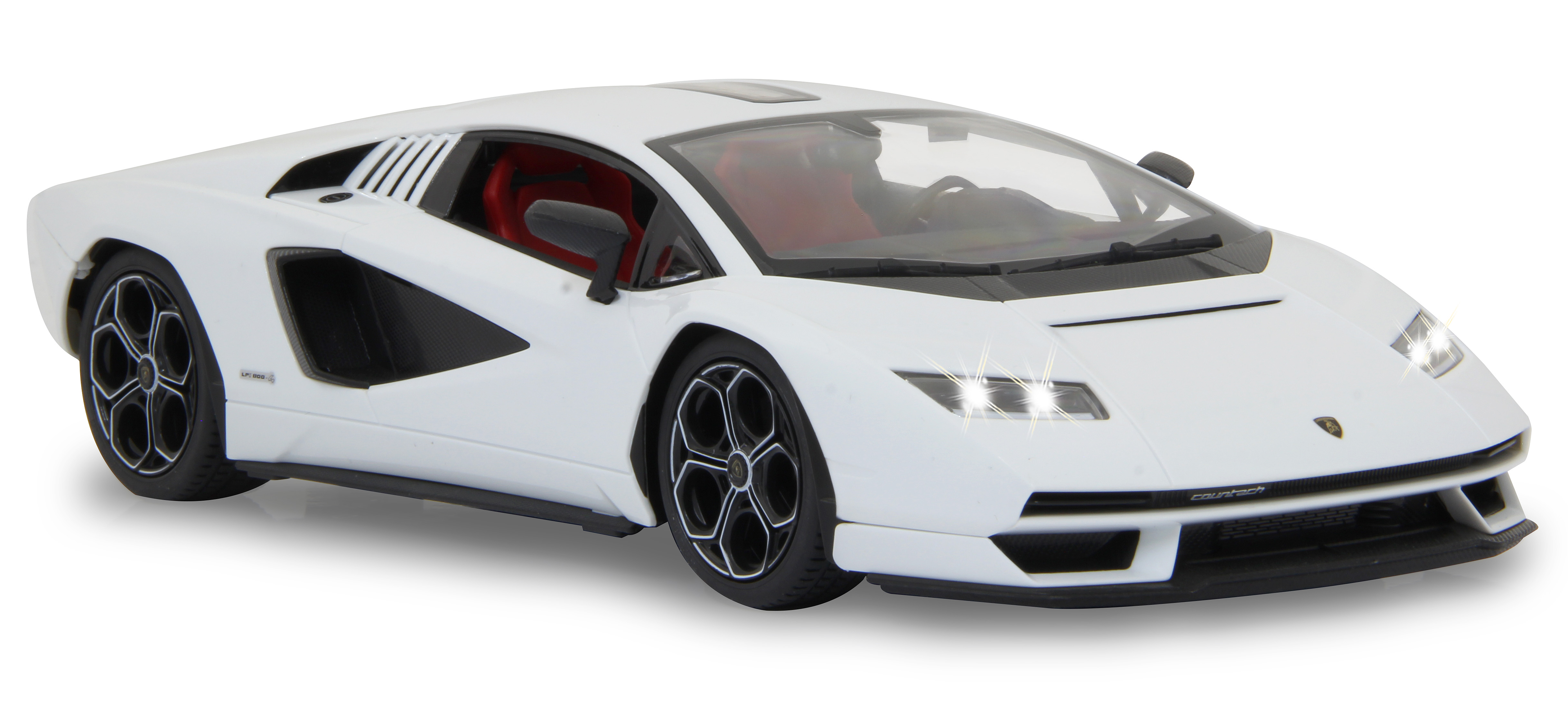 Weißes Lamborghini Countach Auto mit eingeschalteten Lichtern, von vorne.