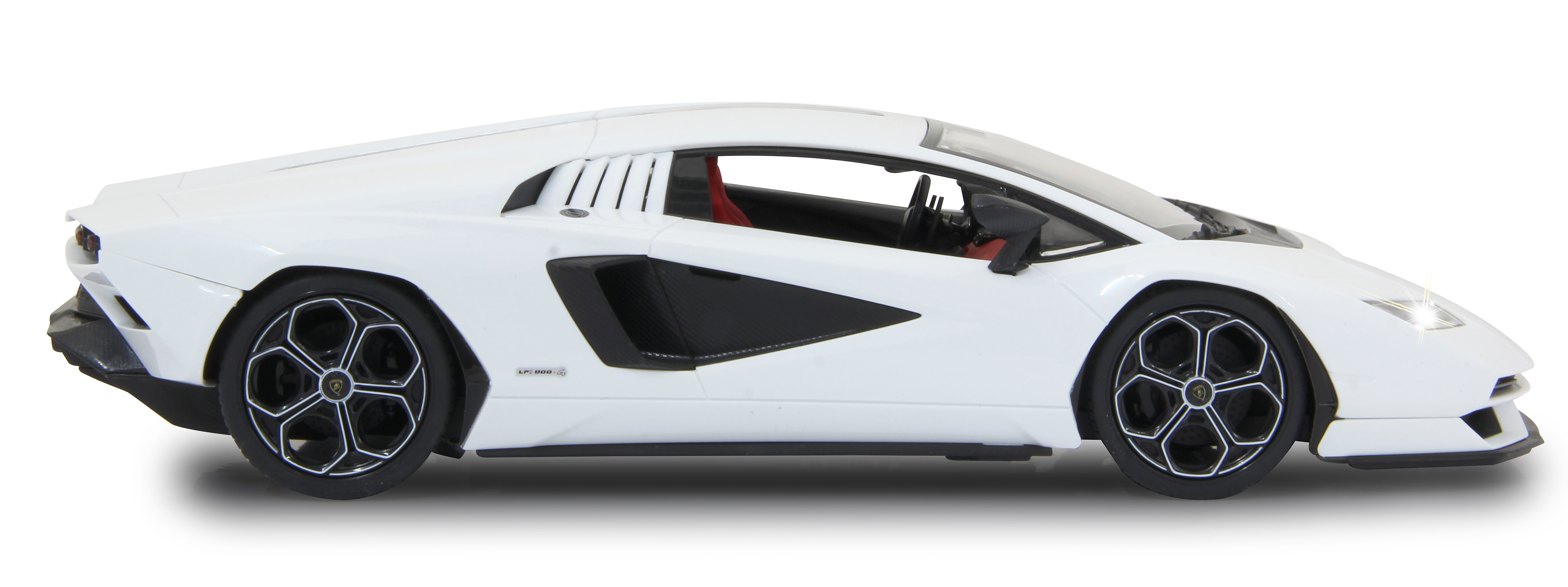 Weißes Lamborghini Countach Auto von der Seite mit roter Innenausstattung und schwarzen Rädern.