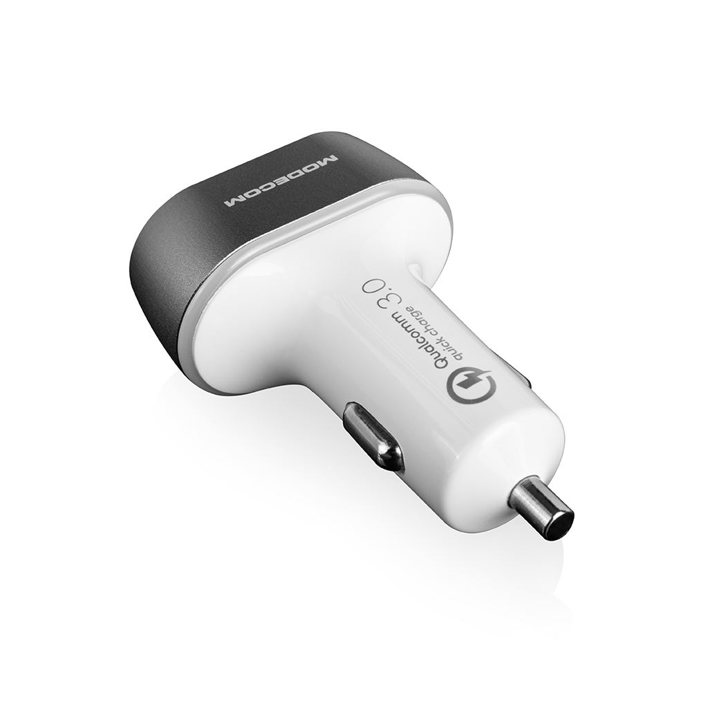 Ładowarka samochodowa z 1 portem USB. Srebrna góra, czarna podstawa. Napis "Qualcomm 3.0" i "MODECOM".