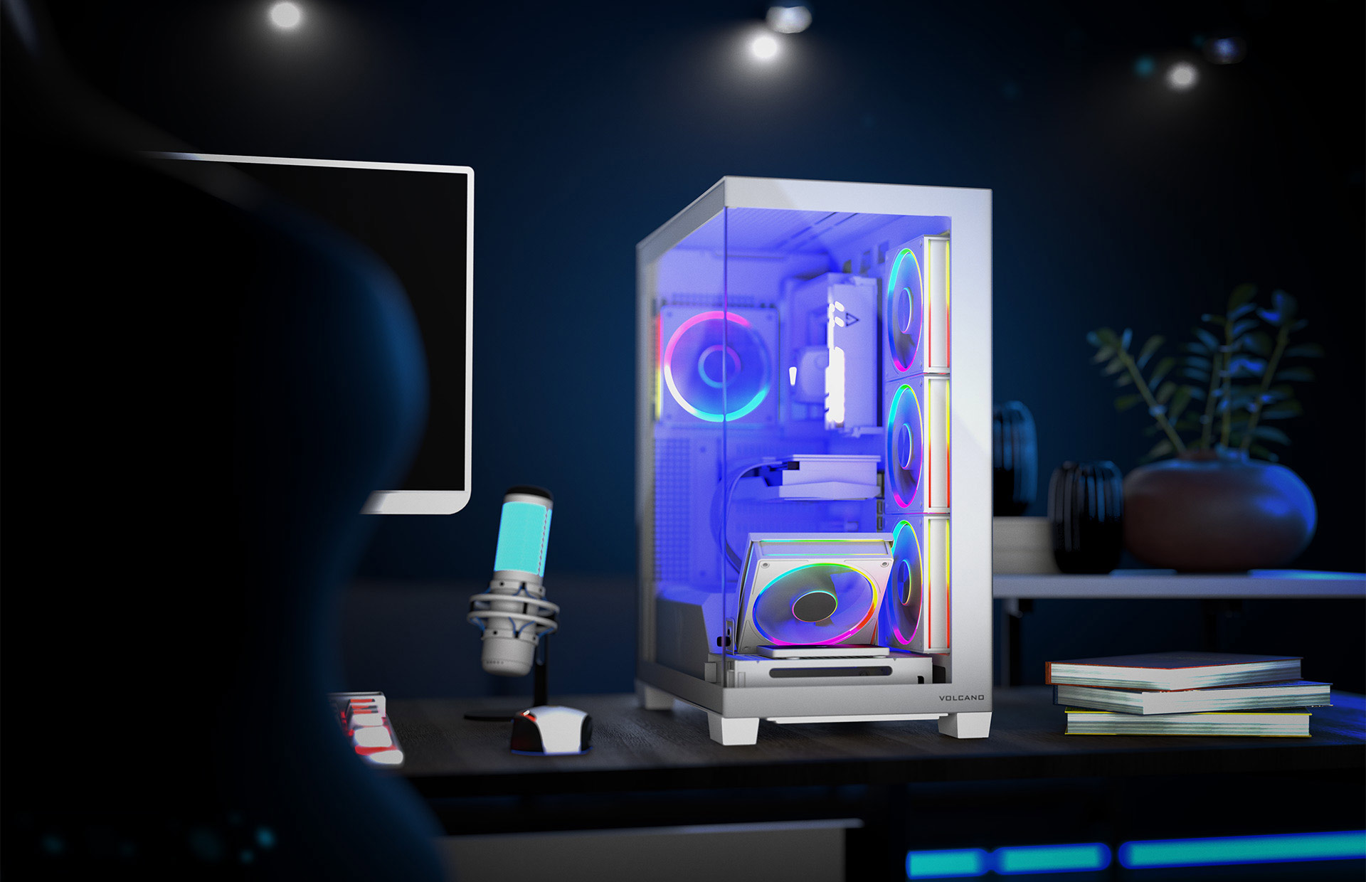 Komputer i urządzenia peryferyjne na biurku. Osoba na pierwszym planie, ciemne tło.