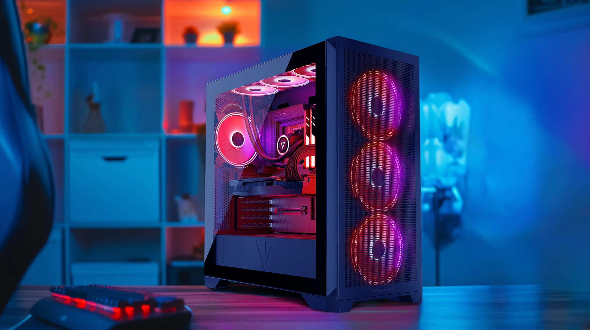 Obudowa komputera z wentylatorami RGB. Widoczne komponenty wewnętrzne, podświetlane na czerwono i fioletowo.